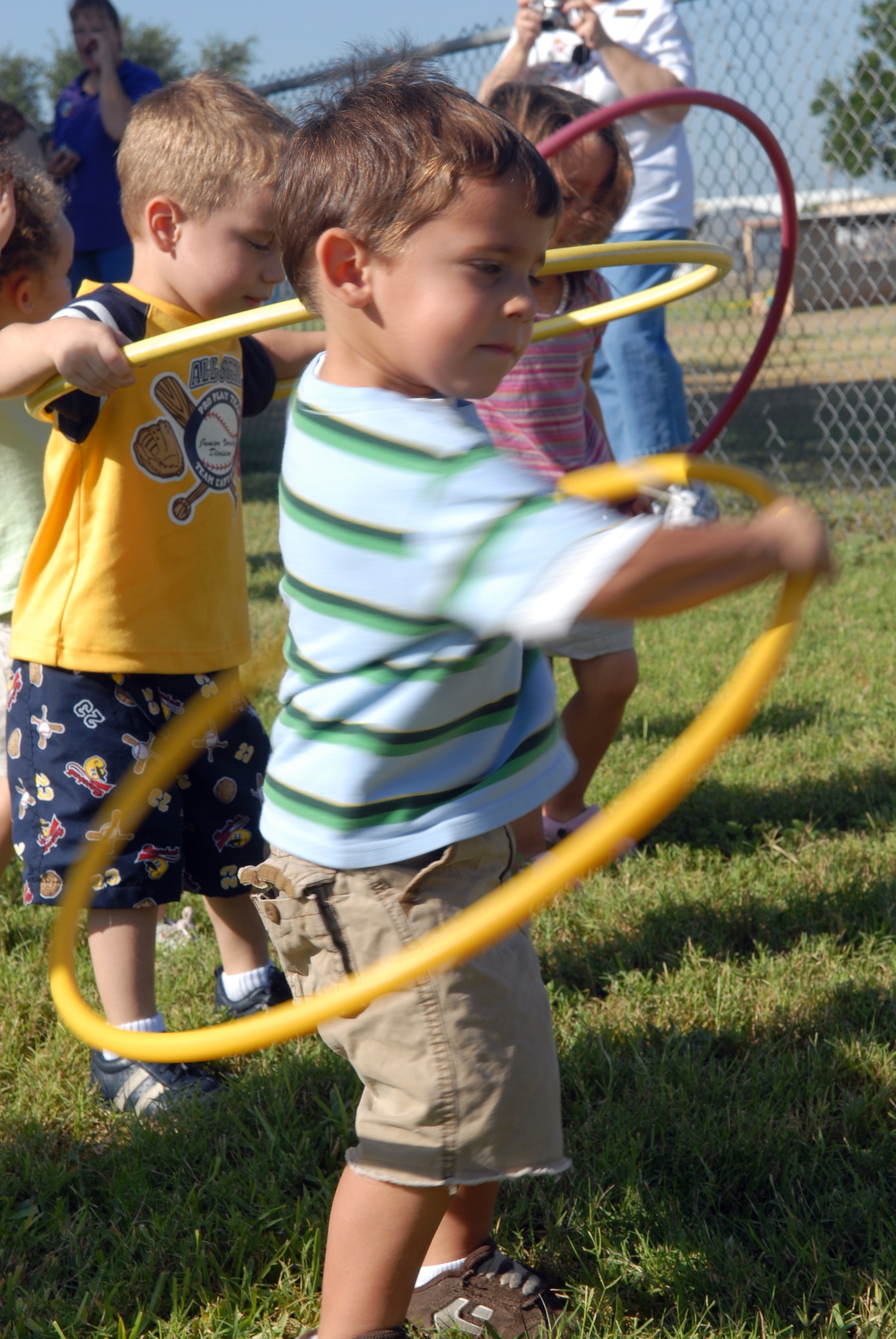 3-year-old Bailen Lewis participates in the hula hoop event during the Goodfellow Air Force Base Child Development Center’s Little Olympics Aug. 10. (U.S. Air Force photo by Airman 1st Class Kamaile Chan)