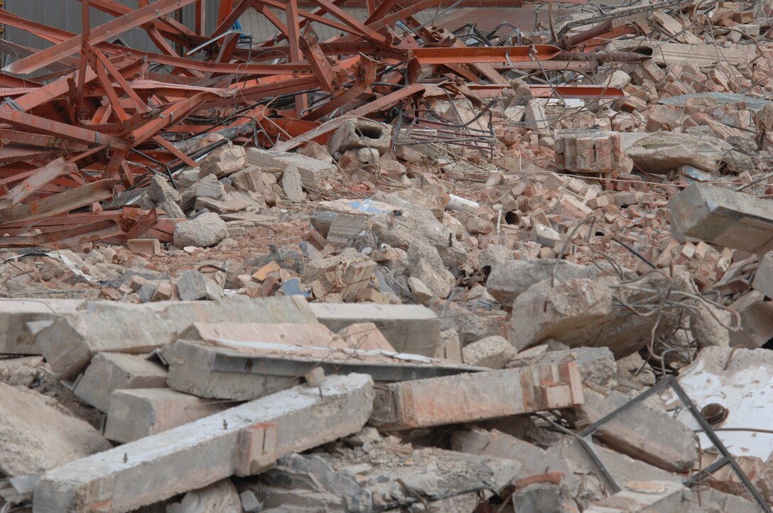 The contractor in charge of the demolition project for Building 402 estimates 2,000 tons of rubble will need to be removed from the base, Aug. 13, 2007. The materials are first sorted into piles such as scrap metal and concrete. However, the unsorted mess will be crushed and recycled and finally sold for future building construction. (U.S. Air Force photo by Tech. Sgt. Tracy L. DeMarco)