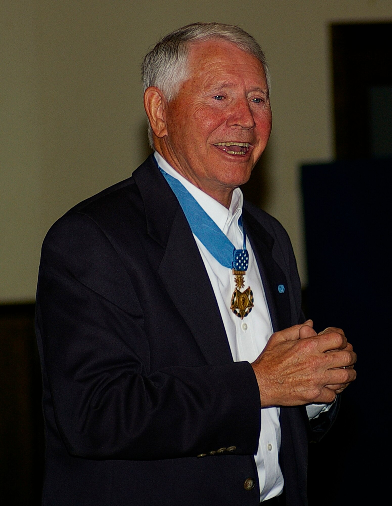 Vietnam War pilot and Medal of Honor recipient Retired Lt. Col. Leo Thorsness uses anecdotes  to share his wartime experiences with RAF Mildenhall Airmen Aug. 8 at the Galaxy Club. (U.S. Air Force photo by Karen Abeyasekere) 