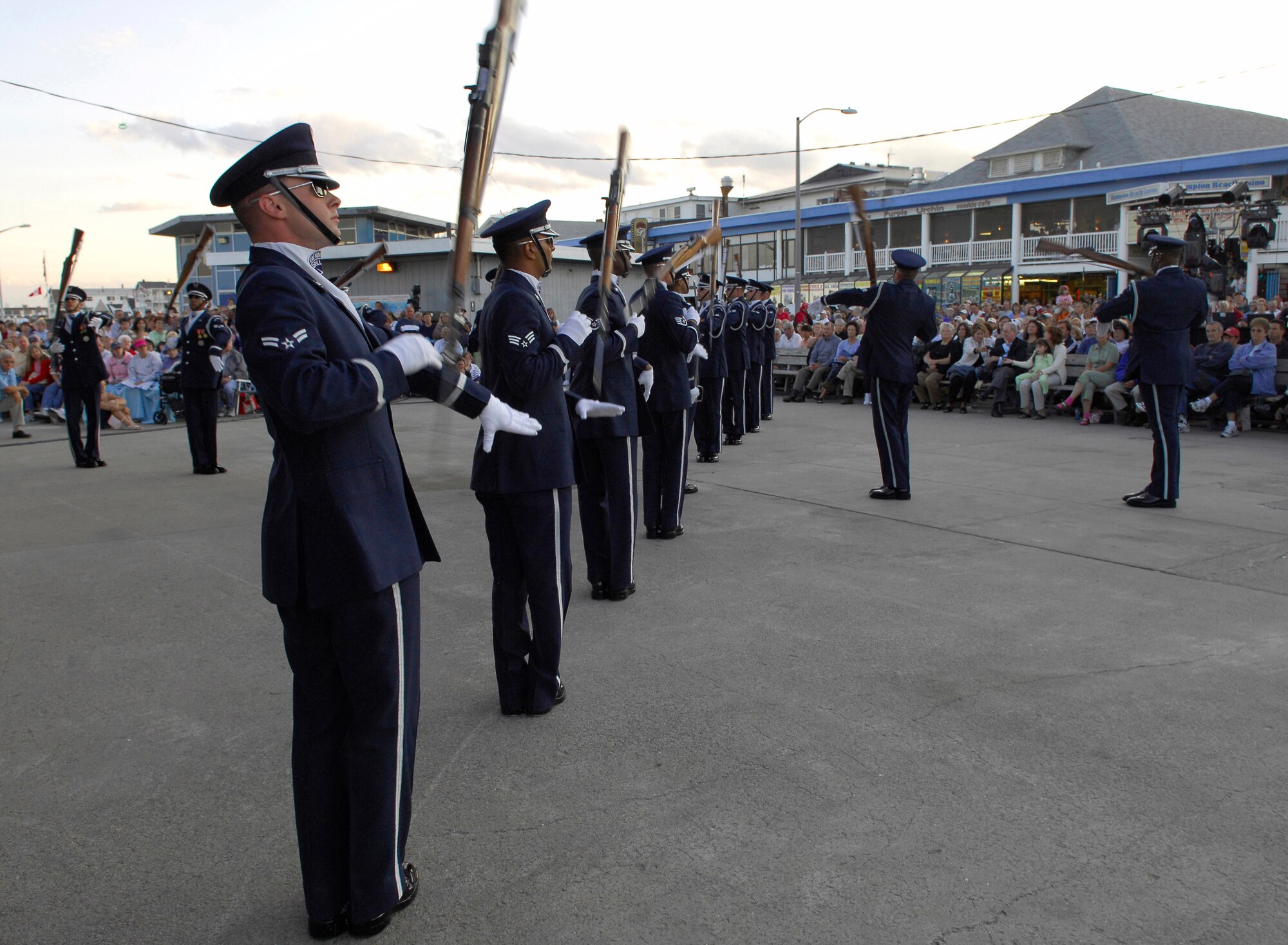 The USAF Honor Guard Drill Team spins their rifles steadily in front of more than 2,000 New England natives at the Hampton Beach, NH performance August 19. Hampton Beach hosted a combined Tops in Blue & Drill Team performance in celebration of Air Force Week which began August 15th and ends the 22nd. (U.S. Air Force photo by Airmen 1st Class Alexandre Montes)(Released)