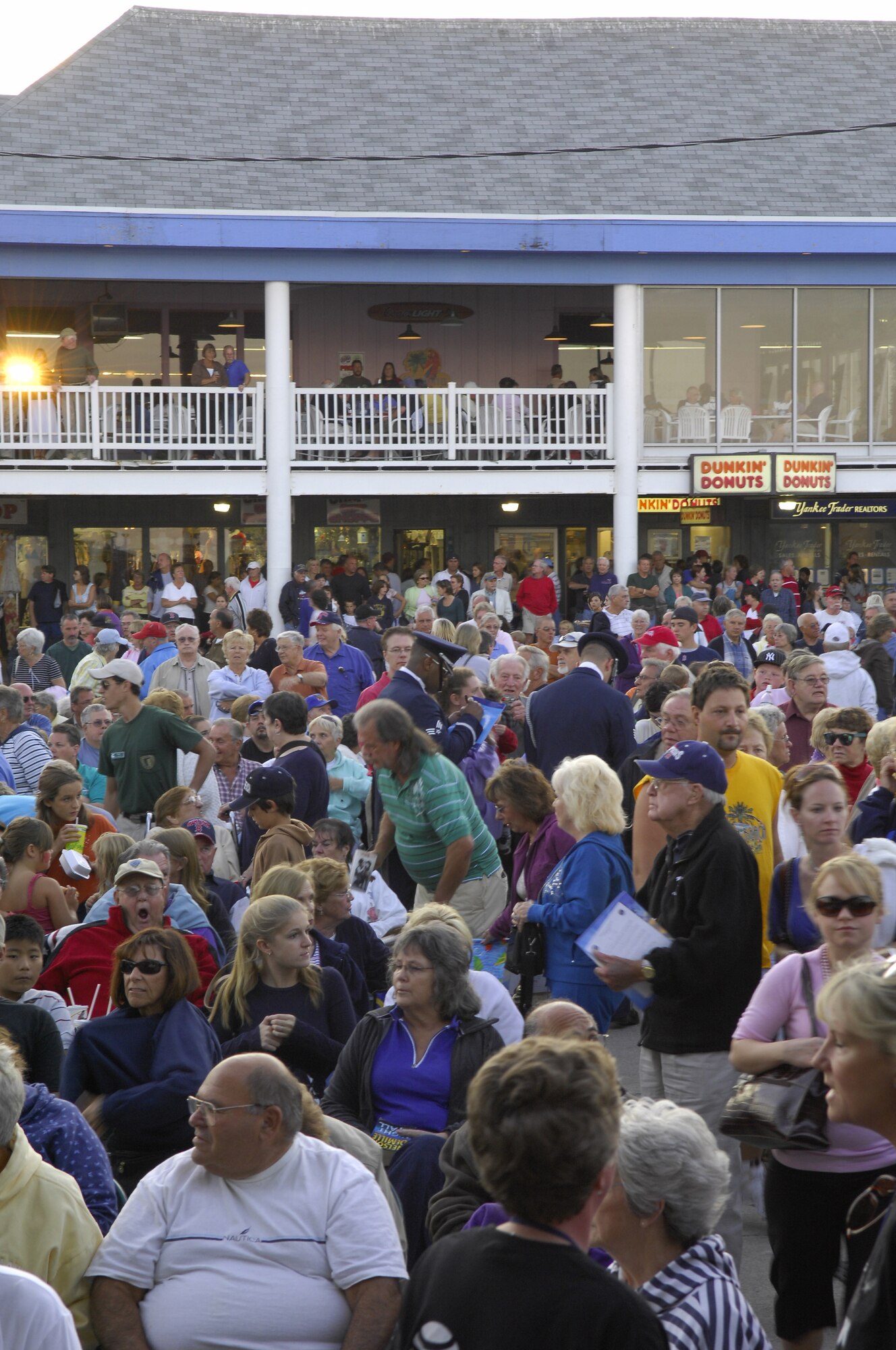 After a performance at Hampton Beach, NH, a sea of people encircle Staff Sgt. Michael Doss and Senior Airman Issac Kendrick, Drill Team members, for autographs and photos.  In a special joint performance, the Drill Team opened 30-minutes before the Tops In Blue concert and helped show AF pride & precision to the crowd of more than 2,000 New England natives. (U.S. Air Force photo by Airmen 1st Class Alexandre Montes)(Released)