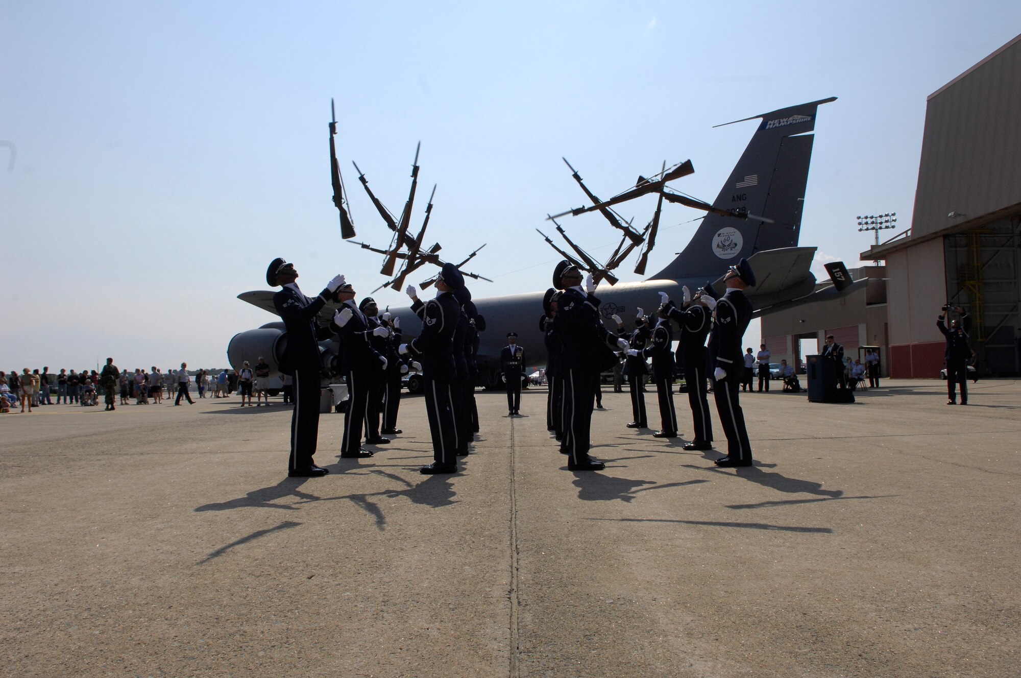 The USAF Honor Guard Drill Team performs in front of a KC-135 "Stratotanker" during a special invite-only event for chidlren in the New England area Make-a-Wish Foundation. The Drill Team kicked-off the Wings of Hope Air Show at Pease ANGB, NH as part of the Air Force Week events which began August 15th and end the 22nd. (U.S. Air Force photo by Airmen 1st Class Alexandre Montes)(Released)