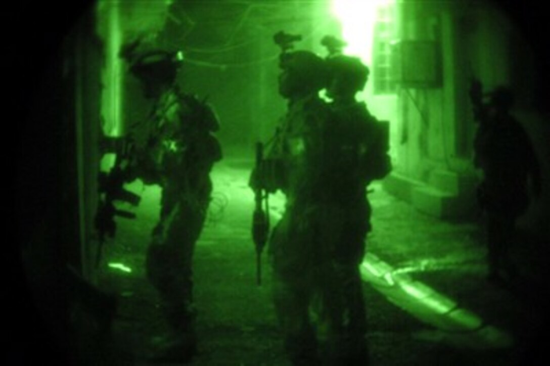 Iraqi special operations forces, advised by U.S. Special Forces, conduct a combat operation to detain suspected terrorist leaders of an insurgent force in Baghdad, Iraq, Aug. 14, 2007. 