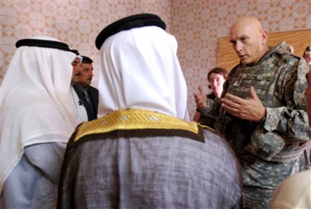 Commander of Multi-National Corps - Iraq Lt. Gen. Ray Odierno (right) U.S. Army, meets with local religious leaders at Patrol Base Warrior Keep, Iraq, on Aug. 18, 2007.  Citizens of Sadr Al Yusufiyah, in partnership with coalition forces and local leaders, are volunteering to help provide fixed-site security at various locations throughout the village.  