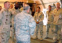 SOUTHWEST ASIA - Vehicle maintainers from the 64th Air Expeditionary Group in Southwest Asia brief Brig. Gen. Charlie Lyon, 379th Air Expeditionary Wing commander about their mission. The Airmen are based out of Misawa Air Base, Japan. (U.S. Air Force photo by Staff Sgt. Evangeline Guidry)