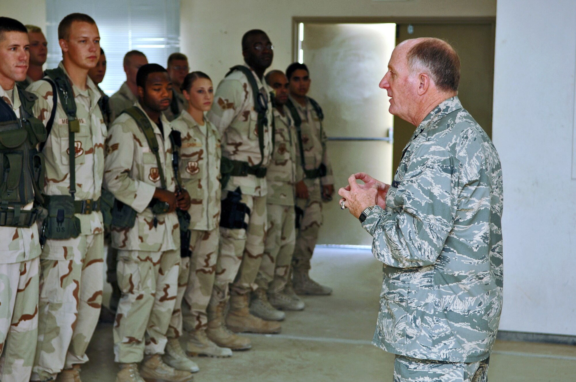 Chaplain (Maj. Gen.) Charles Baldwin, Air Force chief of chaplains, discusses spiritual health with Airmen deployed to the 379th Expeditionary Security Forces Squadron in Southwest Asia Aug. 13. (U.S. Air Force photo/Master Sgt. Ken Stephens)
