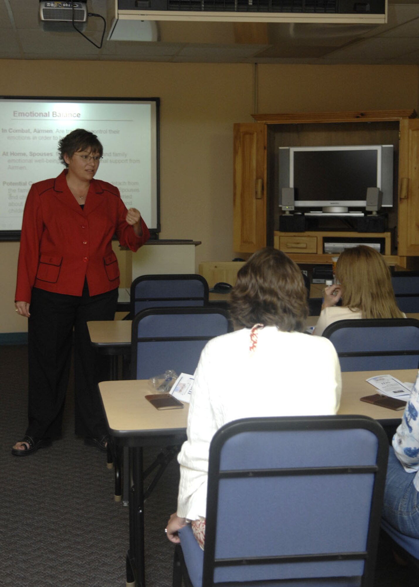 Ms. Tracey Spencer, Airman and Family Readiness Center hosts a pre-deployment briefing for spouses of deploying Airmen. This briefing was held to inform spouses about  what goes on with their deploying spouse and what the center can provide for them while their spouse is deployed. (U.S Air Force photo/Airman 1st Class Rachel Kocin)