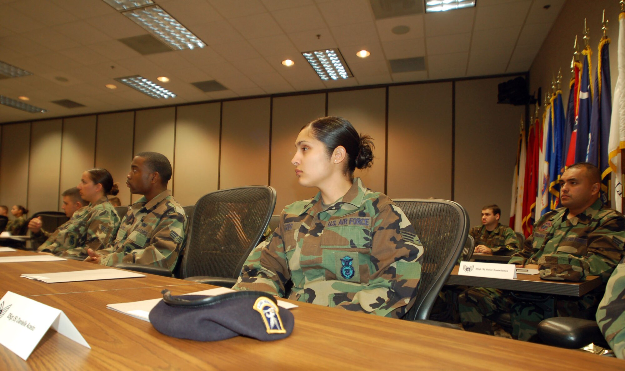 Senior Airman Danielle Acedo, 95th Security Forces Squadron patrolman, together with more than 40 Edwards senior airmen, listens during the Noncommissioned Officer Expectation meeting at the Conference Center Aug. 16. Seventy Edwards senior airmen were selected for promotion to staff sergeant. (Photo by Airman 1st Class Julius Delos Reyes)