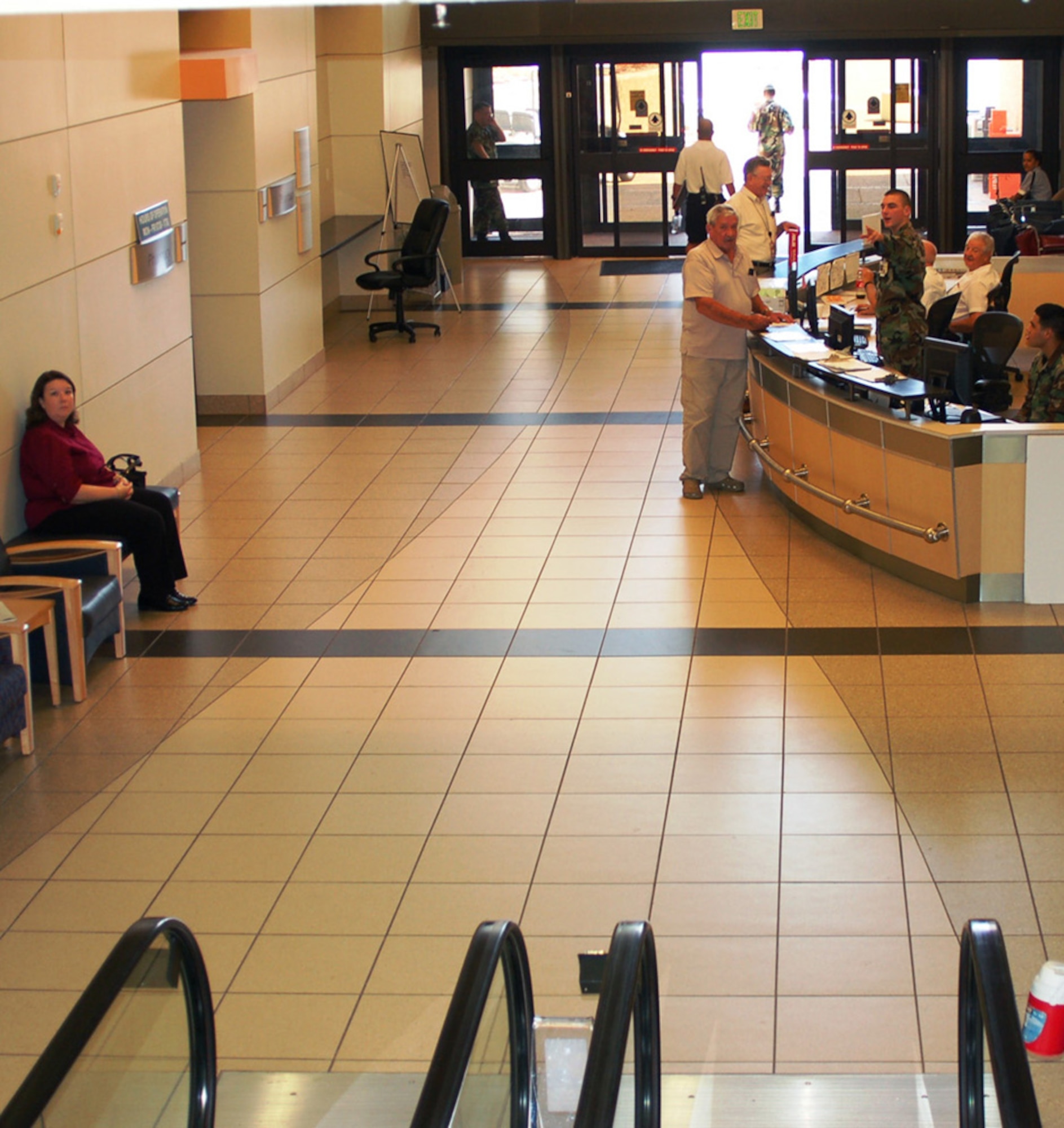 The completely renovated lobby is shown earlier this month.  New escalators and an elevator had to be installed to replace those damaged by the storm.  Ironically, planned renovation of the lobby was scheduled to begin Sept. 1, 2005, three days after Katrina battered the base.  (U.S. Air Force photo by Steve Pivnick)