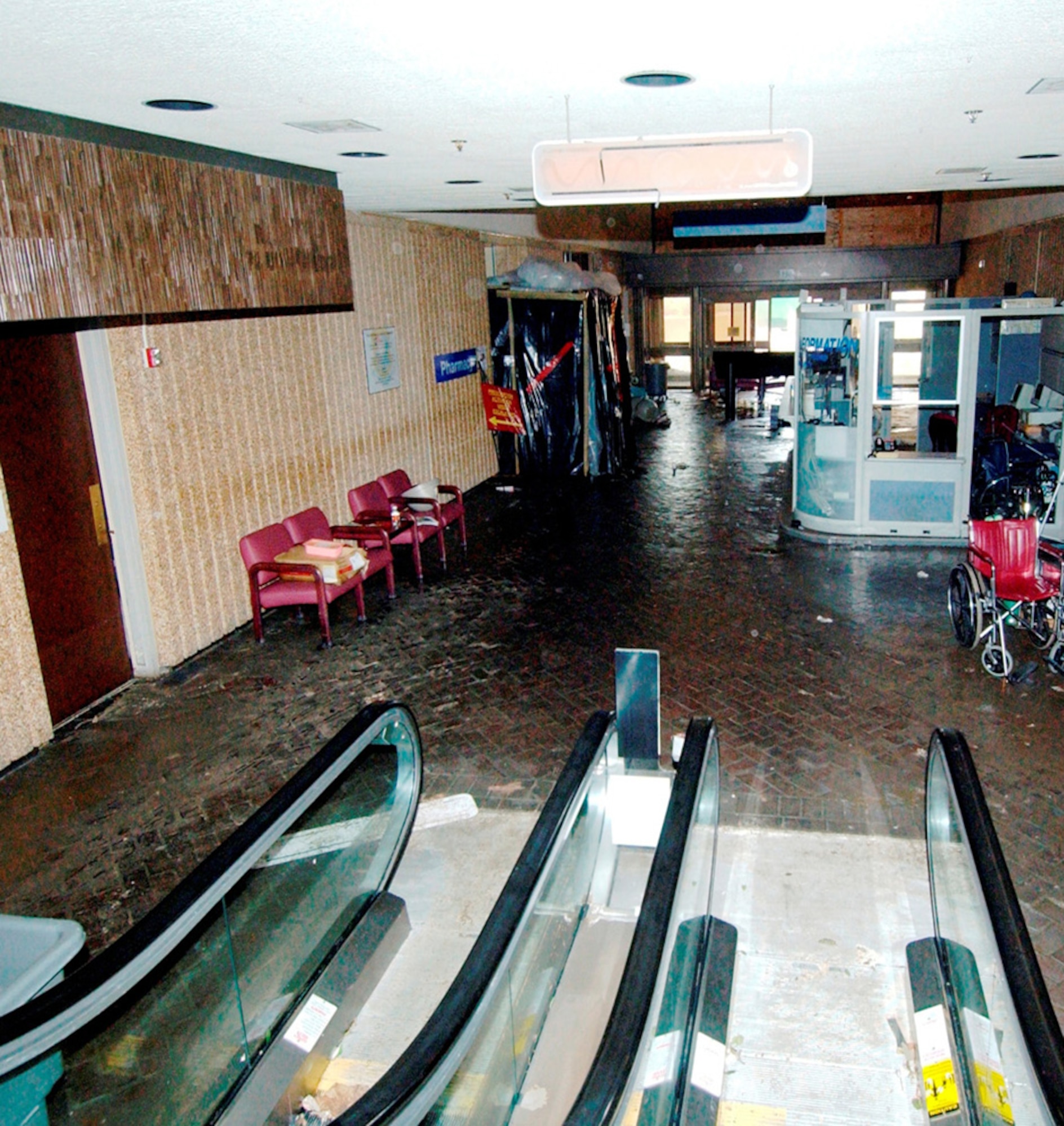 The outpatient clinic entrance lobby at Keesler Medical Center shows evidence of Katrina’s storm surge shortly after the hurricane struck — a water line is visible over the red chairs on the left.  (U.S. Air Force photo)