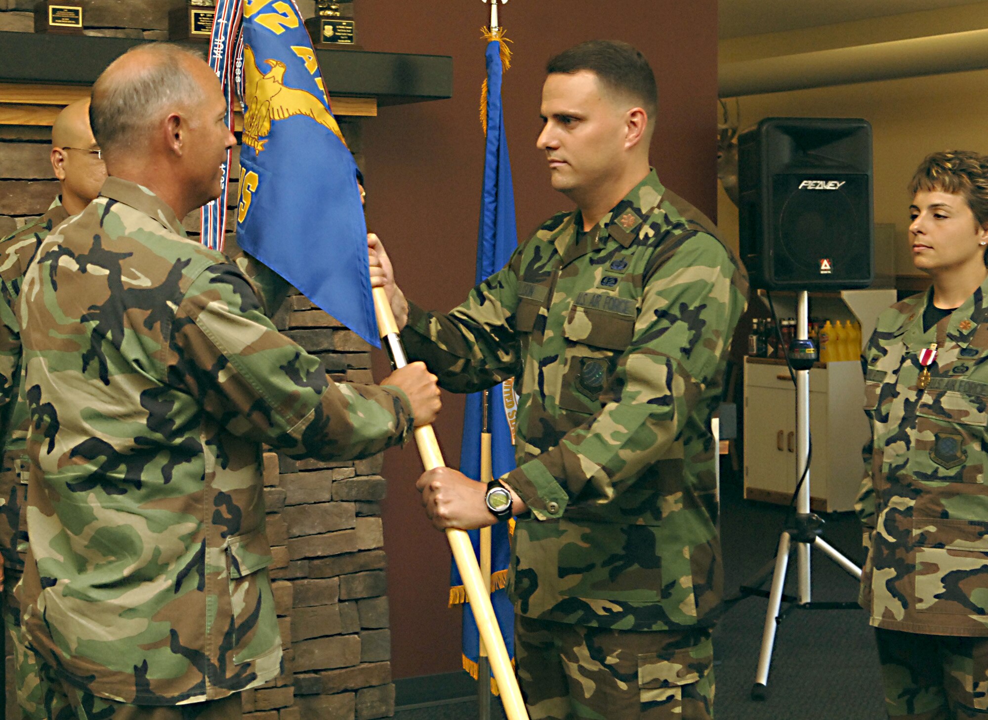 FAIRCHILD AIR FORCE BASE, Wash. – Maj. David Ellison, new 92nd Services Squadron commander, receives the squadron flag from Col. Van Fuller, 92nd Mission Support Group commander. Major Ellison received command from Lt. Col. Gina Humble during a change-of-command ceremony Aug. 15. (U.S. Air Force photo / Senior Airman Chad Watkins)