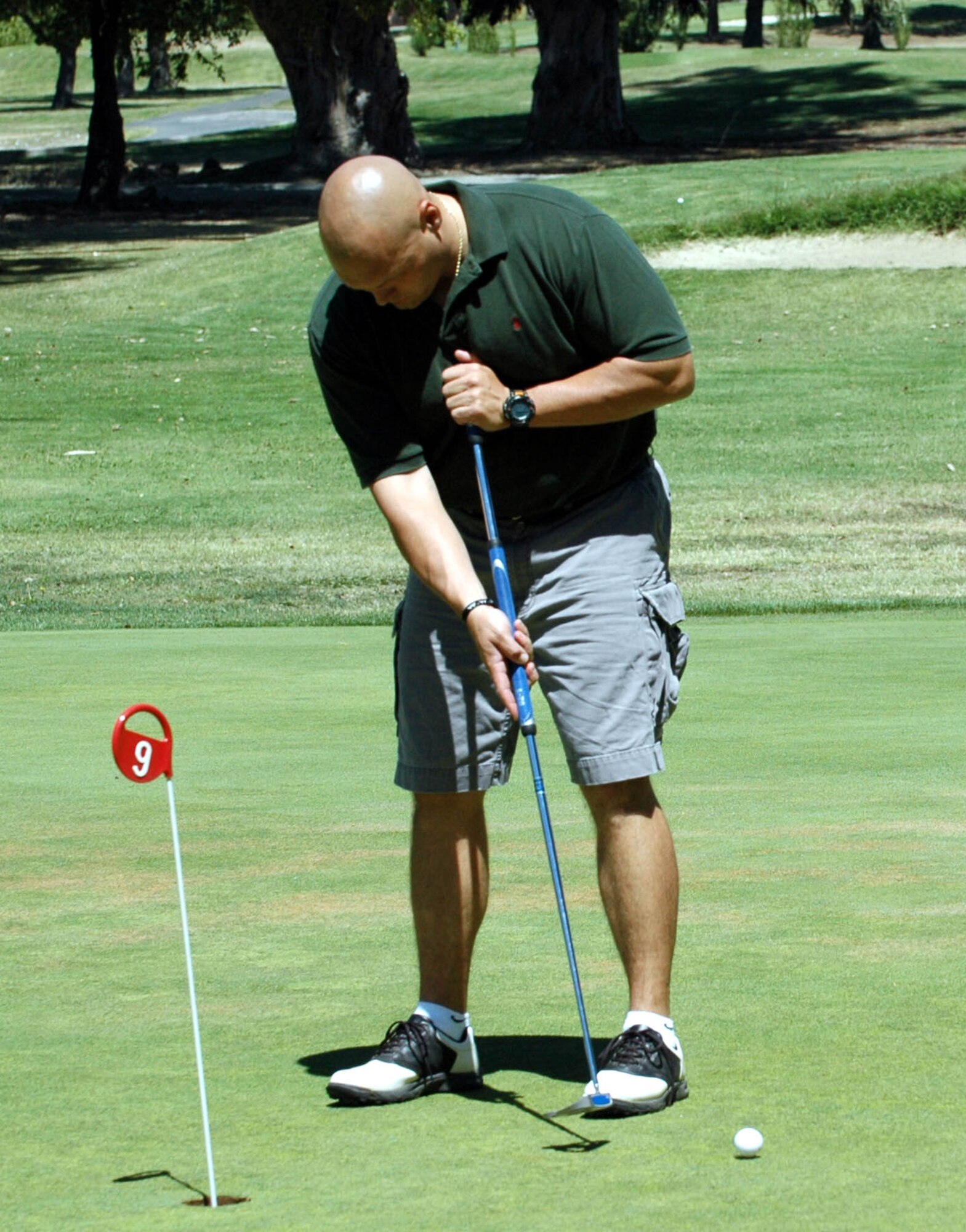 Michael Shirley takes a few practice putts before the 60th Air Force Anniversary Golf Tournament at the Cypress Lakes Golf Course Aug. 17. Proceeds from the tournament will be used for the 60th Air Force Anniversary Ball, Sept. 14. (U.S. Air Force photo/Staff Sgt. Candy Knight)