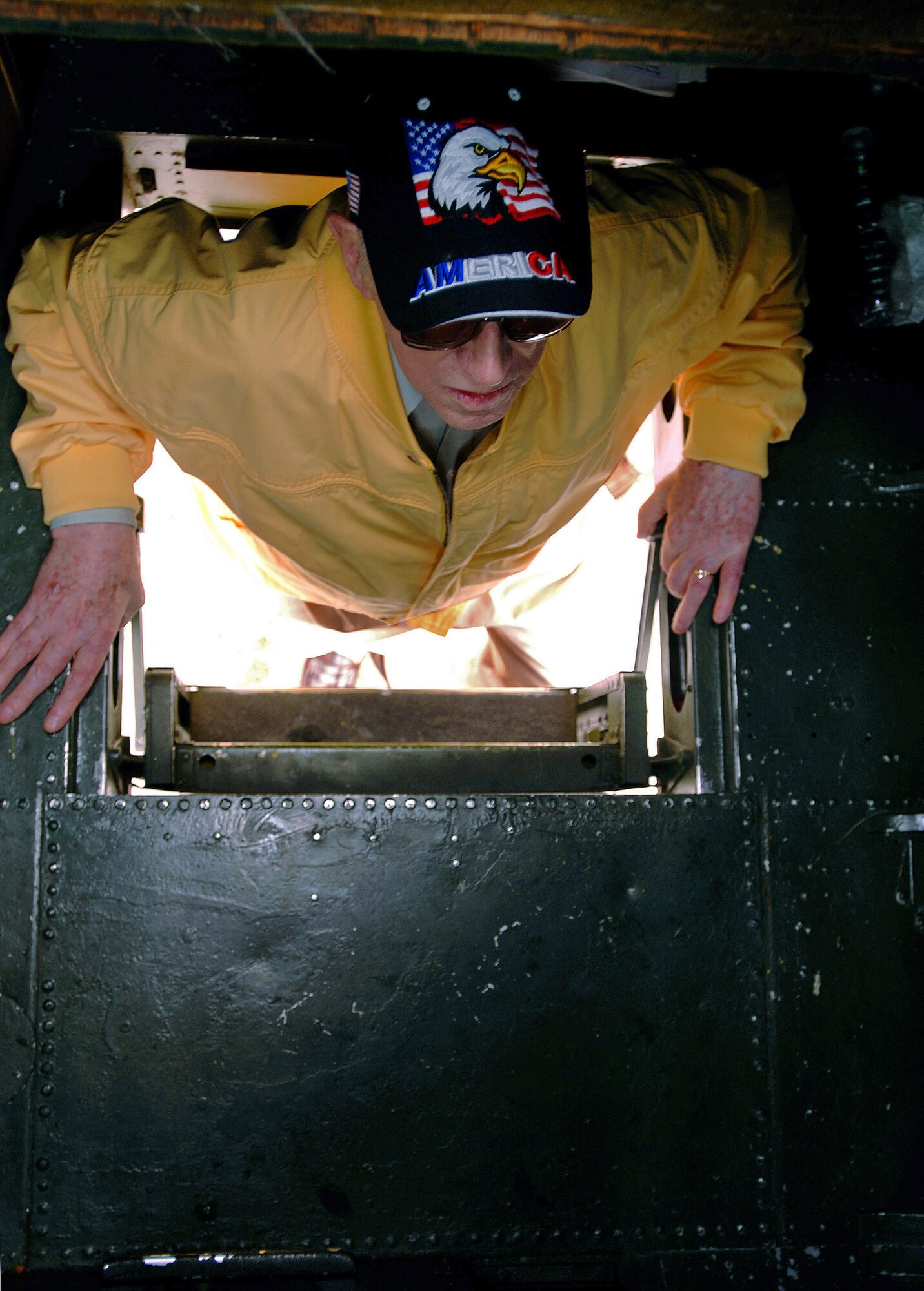World War II veteran Robert McNally climbs aboard a B-25 Mitchell Aug. 19 at Pease Air National Guard Base at Portsmouth, N.H. The B-25 called the "Miss Hap," is the oldest flying B-25 Mitchell bomber in the world and the personal aircraft of Gen. Henry "Hap" Arnold, the only general of the Air Force. Mr. McNally, 81, was a guest attending the 2007 Wings of Hope Air Show with hopes of being reunited with old friends. The 2007 Wings of Hope Air Show at Pease ANGB is in conjunction with Air Force Week New England.  (U.S. Air Force photo/Staff Sgt. Bennie J. Davis III) 
