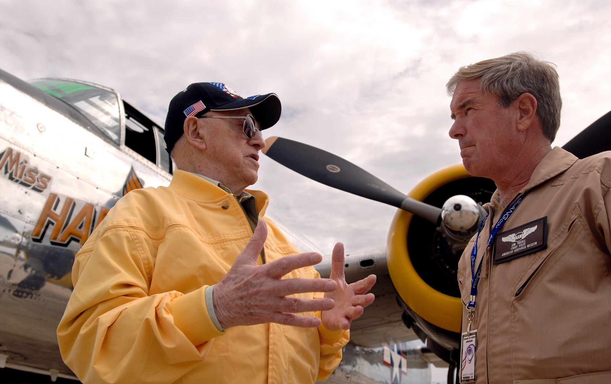 World War II veteran Robert McNally talks with Jim Vocell Aug. 19 at Pease Air National Guard Base at Portsmouth, N.H. Mr. McNally, 81, was a guest attending the 2007 Wings of Hope Air Show with hopes of being reunited with old friends. The 2007 Wings of Hope Air Show at Pease ANGB is in conjunction with Air Force Week New England. Mr. Vocell is from the American Airpower Museum and pilot of the "Miss Hap," the oldest flying B-25 Mitchell bomber in the world and the personal aircraft of Gen. Henry "Hap" Arnold, the only general of the Air Force. (U.S. Air Force photo/Staff Sgt. Bennie J. Davis III) 

