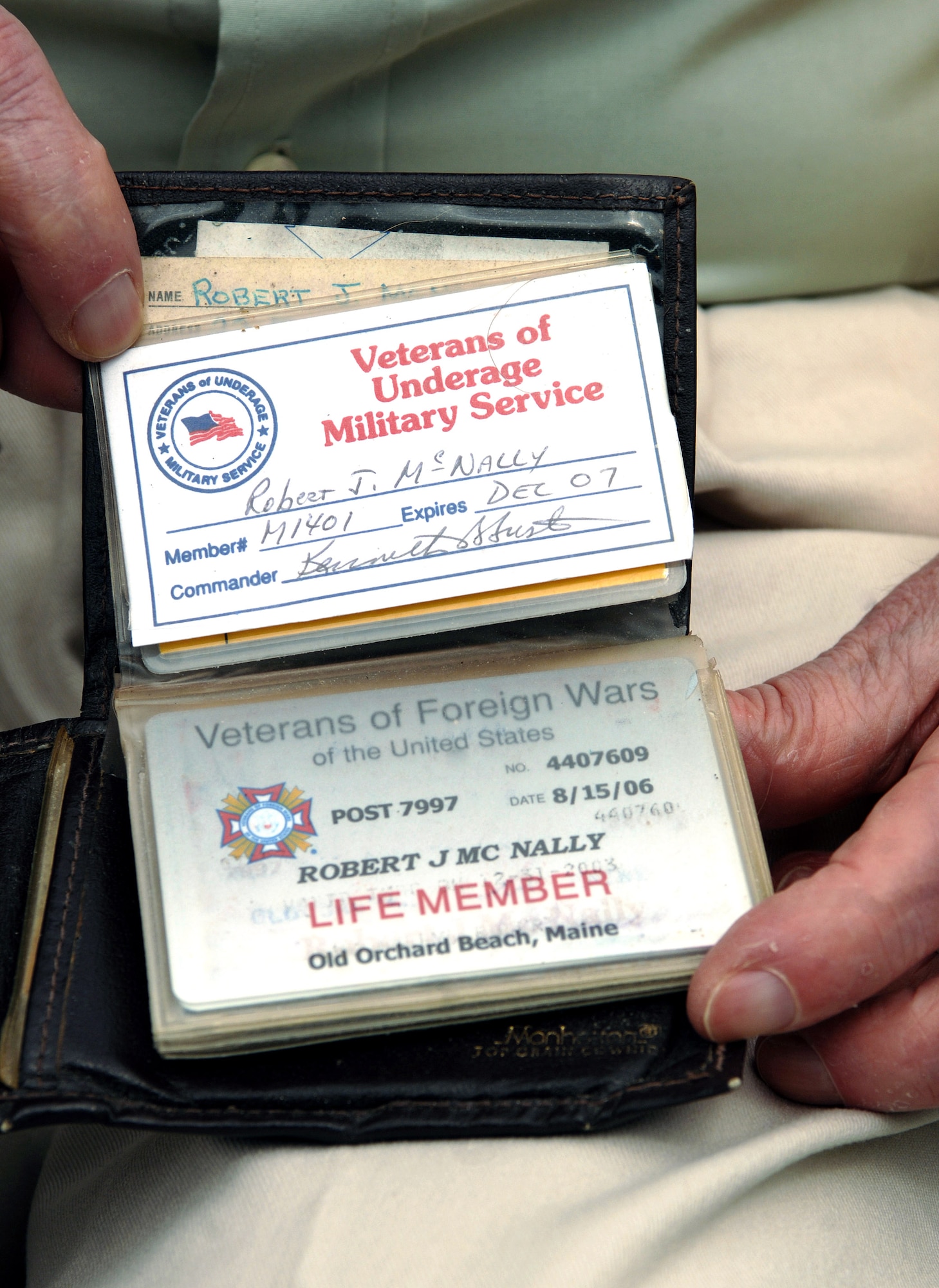 World War II veteran Robert McNally shows off his Veterans of Underage Military Service card, which he earned by enlisting for WWII while only 16 years old Aug. 19 at Pease Air National Guard Base at Portsmouth, N.H. Mr. McNally, 81, was a guest attending the 2007 Wings of Hope Air Show with hopes of being reunited with old friends. The 2007 Wings of Hope Air Show at Pease ANGB is in conjunction with Air Force Week New England. (U.S. Air Force photo/Staff Sgt. Bennie J. Davis III) 
