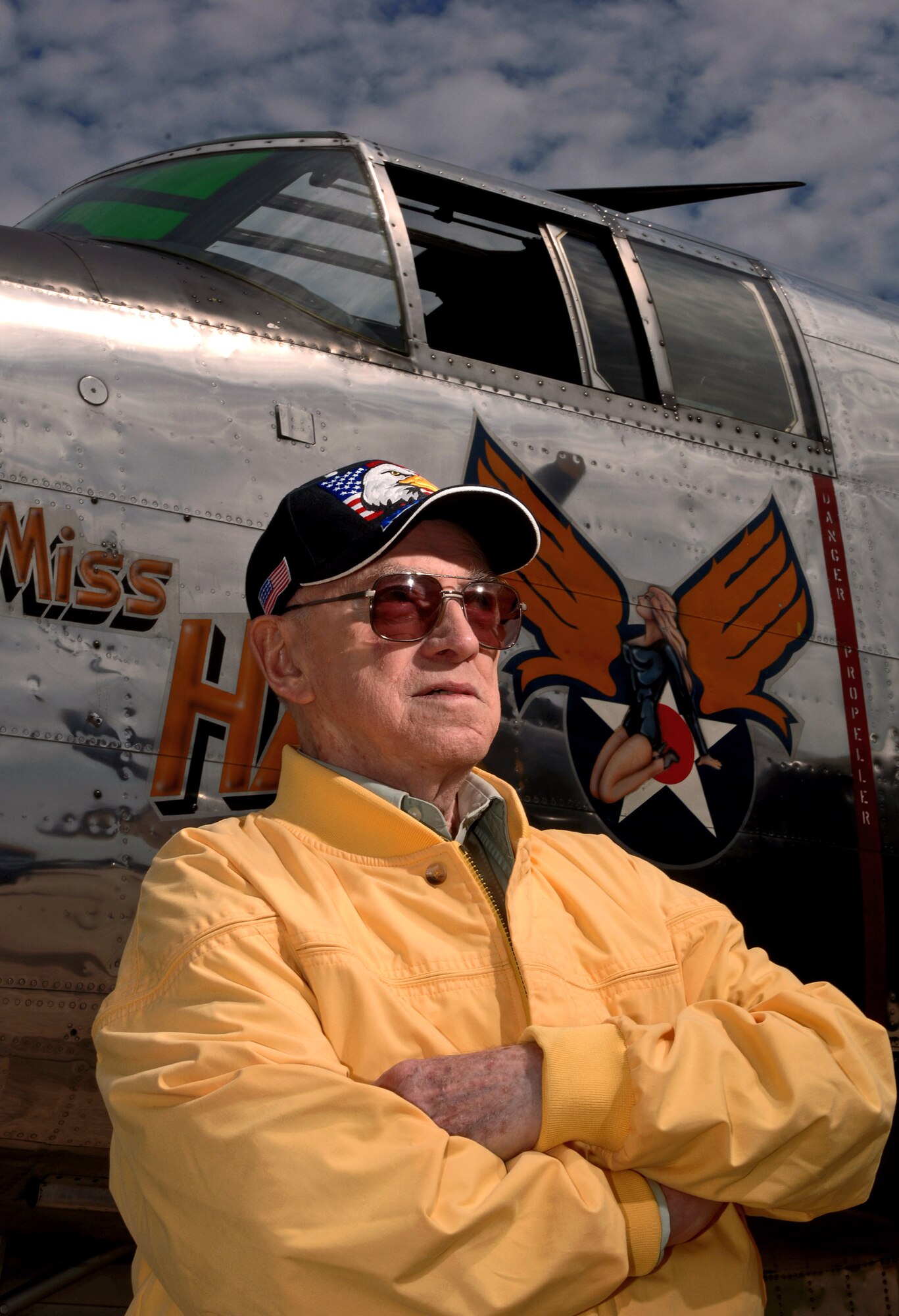 World War II veteran Robert McNally stands before the "Miss Hap," the oldest flying B-25 Mitchell bomber in the world and the personal aircraft of Gen. Henry "Hap" Arnold, the only general of the Air Force Aug. 19 at Pease Air National Guard Base at Portsmouth, N.H. Mr. McNally, 81, was a guest attending the 2007 Wings of Hope Air Show with hopes of being reunited with old friends. The 2007 Wings of Hope Air Show at Pease ANGB is in conjunction with Air Force Week New England. (U.S. Air Force photo/Staff Sgt. Bennie J. Davis III)