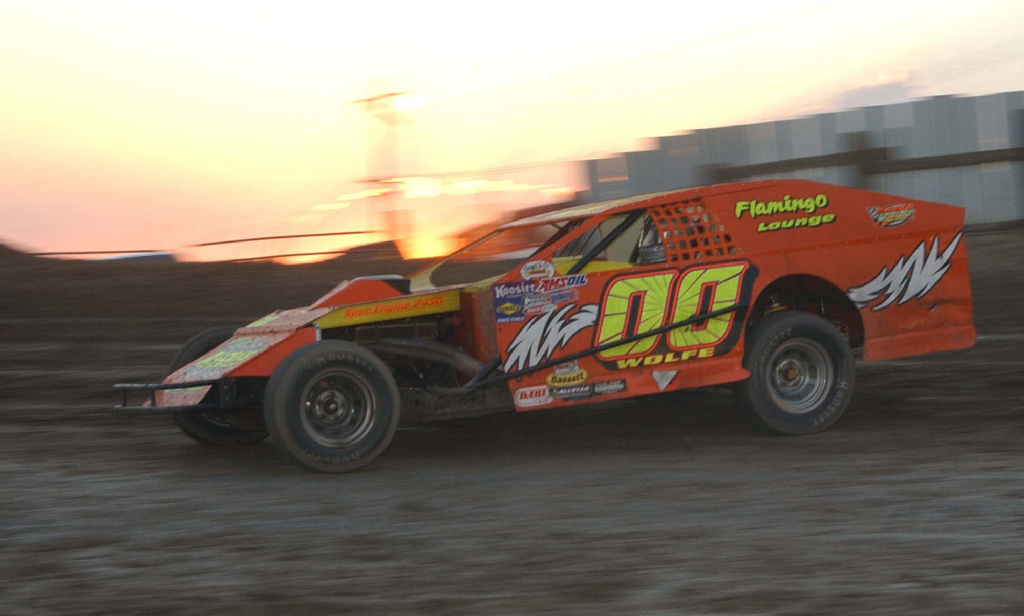 Master Sgt. Russell Wolfe, 341st Logistics Readiness Squadron vehicle fleet manager, races number 00, his modified car at the Electric City Speedway in Great Falls, Mont., July 19. (U.S. Air Force photo/Airman 1st Class Dillon White).