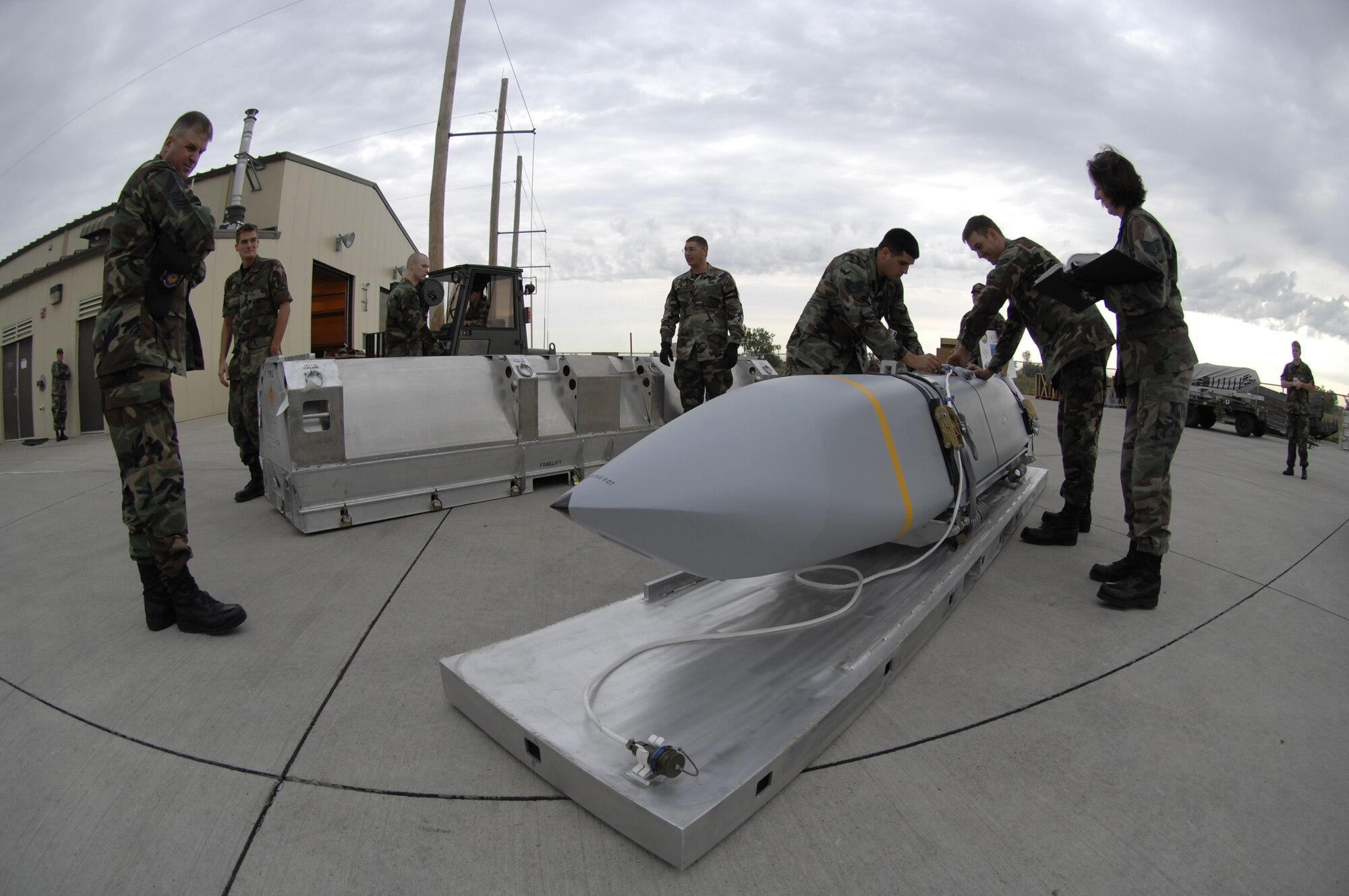 MINOT AIR FORCE BASE, N.D. -- Airmen from the 5th Munitions Squadron inspect a joint air-to-surface standoff missile here Aug. 17. (U.S. Air Force photo by Senior Airmen Christopher Boitz)