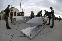 MINOT AIR FORCE BASE, N.D. -- Airmen from the 5th Munitions Squadron inspect a joint air-to-surface standoff missile here Aug. 17. (U.S. Air Force photo by Senior Airmen Christopher Boitz)