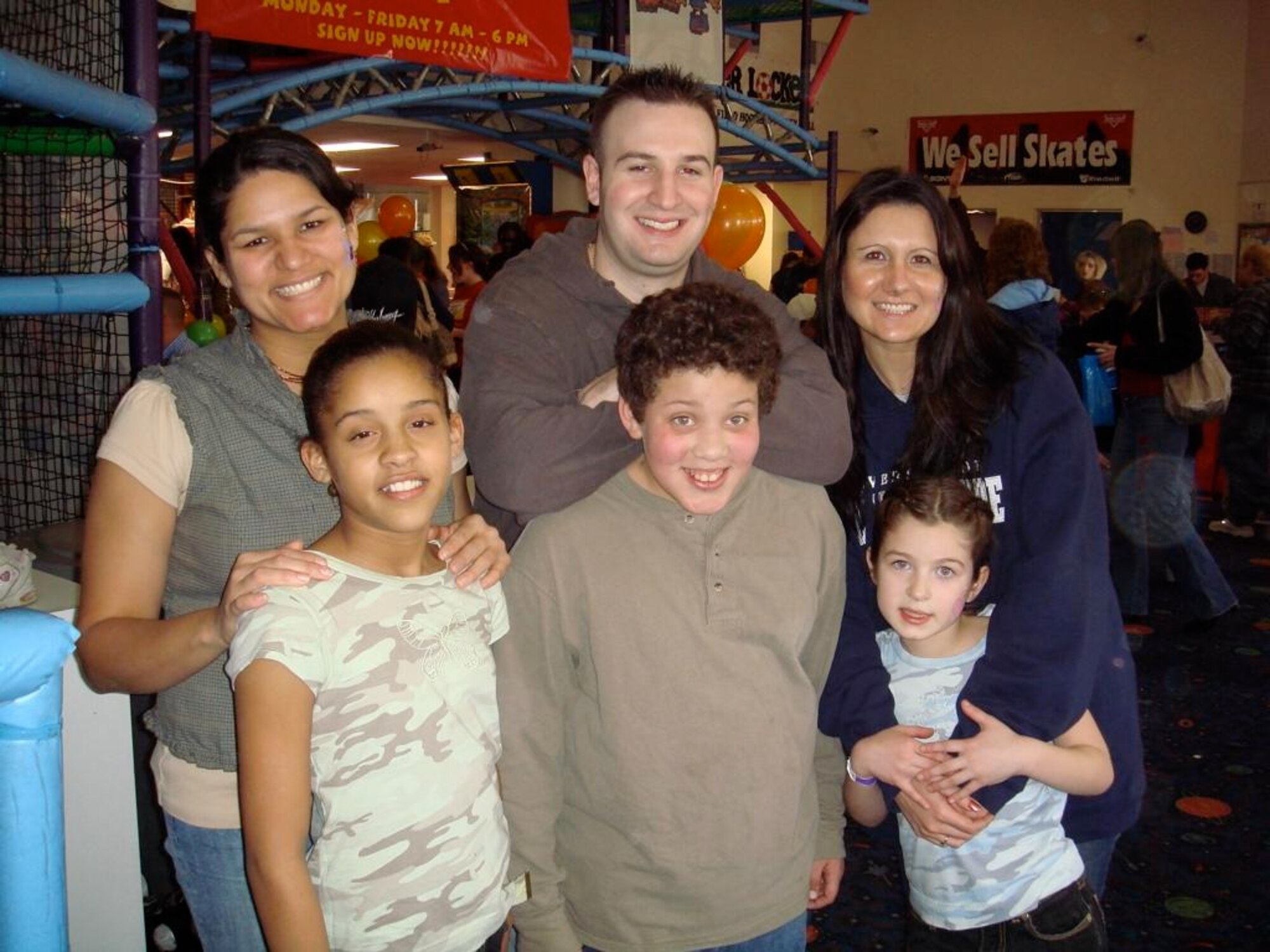 Left to right, Senior Airman Namir Laureano, Senior Airman Robert Mauro, and Capt. Jessica Williams with their littles, Jade, Elijah and Taylor at a Big Brothers/Big Sisters event.