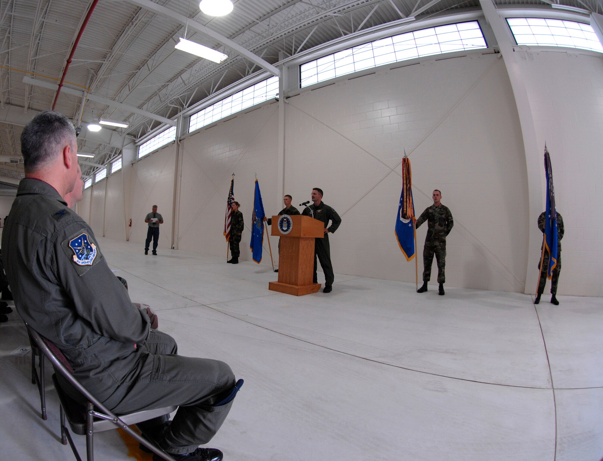 MINOT AIR FORCE BASE, N.D. -- Col. Greg Bell, 5th Bomb Wing vice commander, addresses the audience at the new security forces vehicle storage facility here during a ribbon cutting ceremony Aug. 17. The $7.8 million security forces vehicle facility, dubbed “The Defender Dome” by Col. Marty Whelan, 91st Space Wing commander, provides protected parking for vehicles, three enclosed wash bays, equipment storage, dispatch operations, support offices and a training room. (U.S. Air Force photo by Senior Airman Christopher Boitz)