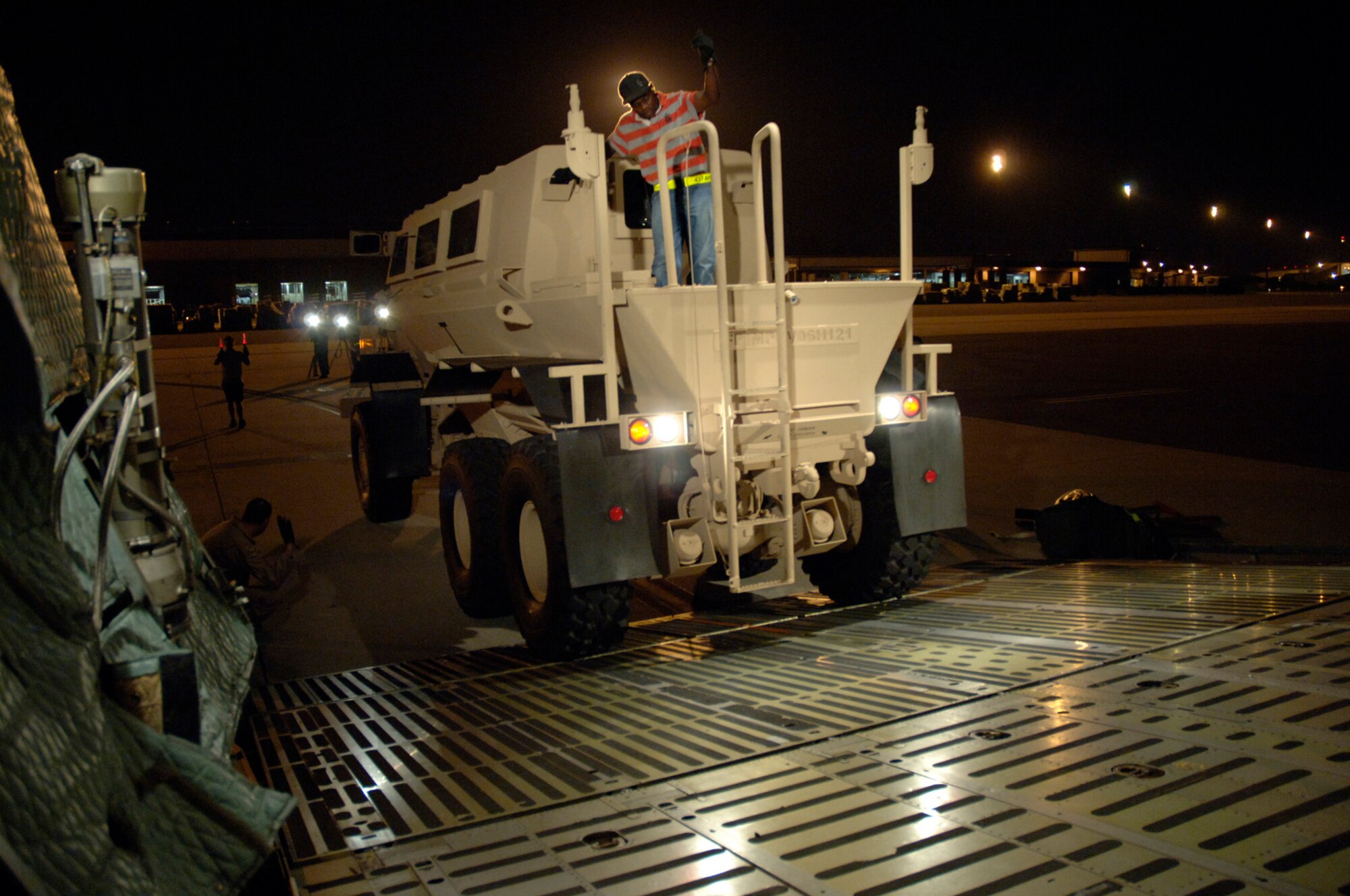 Charleston AFB and Dover AFB members load Mine Resistant Ambush Protected vehicles onto a C-5 Galaxy assigned to the 436th Air Wing, Dover, Air Force Base (AFB), Del. at Charleston AFB, S.C., Aug. 16, 2007. (U.S. Air Force Photo/Staff Sgt. April Quintanilla)