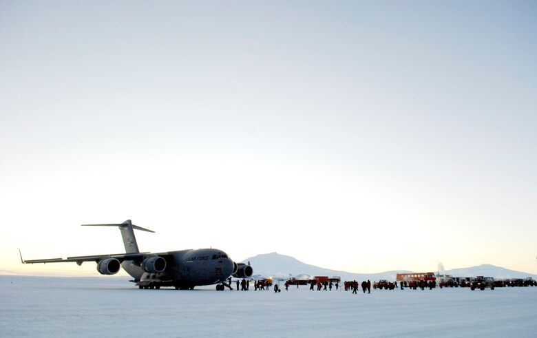 National Science Foundation members get off a C-17 Globemaster III after a winter fly-in mission for Operation Deep Freeze Aug. 20 at Pegasus Runway in Antarctica. A C-17 and 31 Airmen from McChord Air Force Base, Wash., began the annual winter fly-in augmentation of scientists, support personnel, food and equipment for the U.S. Antarctic Program at McMurdo Station. WinFly is the opening of the first flights to McMurdo Station, which closed for the austral winter in February. (U.S. Air Force photo/Tech. Sgt. Shane A. Cuomo) 
