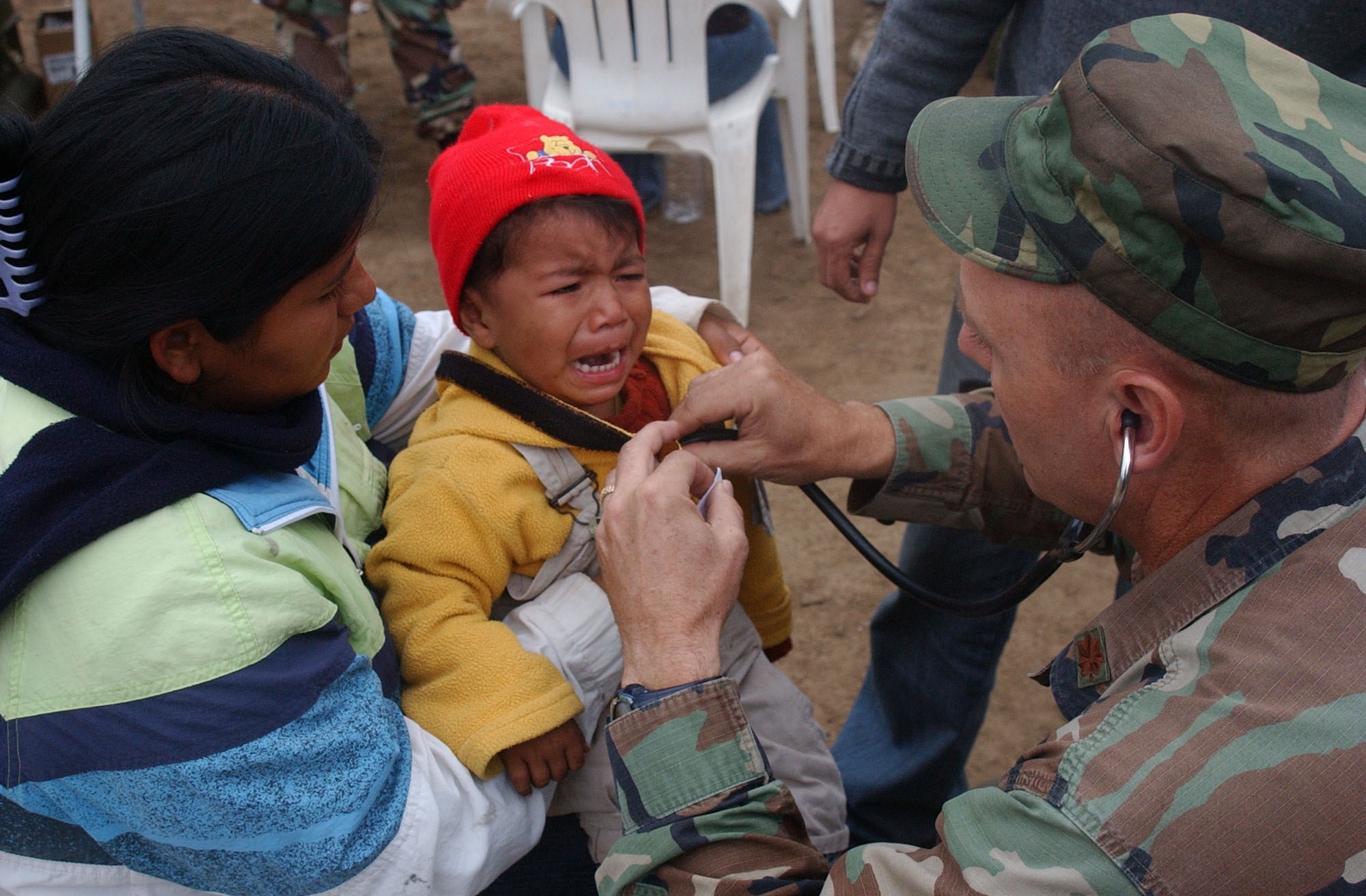 PISCO, Peru - Maj. Joseph Hallock, Joint Task Force-Bravo Medical Element pediatric nurse practitioner, checks the heartbeat of one of the patients at the medical relief site in Pisco, Peru. During the three-day mission, medical personnel provided care to more than 1,500 men, women and children. The task force deployed from Soto Cano Air Base Honduras, Aug. 17 to provide medical care to the people of Pisco following an 8.0 magnitude earthquake that devastated the region. (U.S. Air Force photo by Senior Airman Shaun Emery)