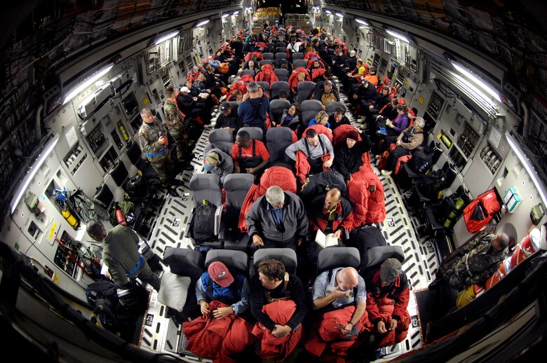 Members of the National Science Foundation load onto a C-17 Globemaster III for a winter fly-in mission during Operation Deep Freeze Aug. 20 at Christchurch, New Zealand. A C-17 and 31 Airmen from McChord Air Force Base, Wash., began the annual winter fly in augmentation of scientists, support personnel, food and equipment for the U.S. Antarctic Program at McMurdo Station. WinFly is the opening of the first flights to McMurdo station, which closed for the austral winter in February. (U.S. Air Force photo/Tech. Sgt. Shane A. Cuomo) 

