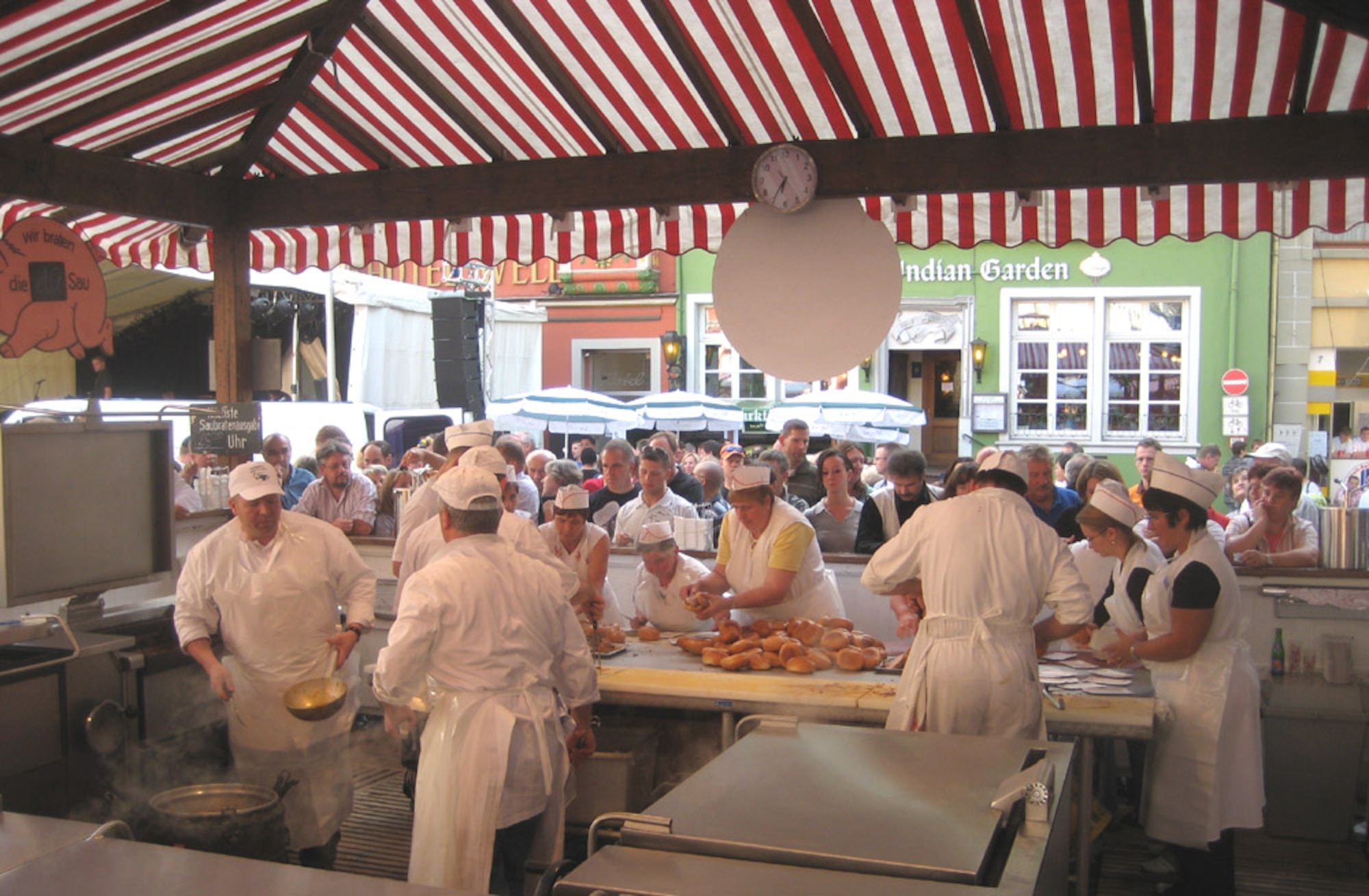 SPANGDAHLEM AIR BASE, Germany – Festival supporters prepare traditional “schwenkbraten” sandwiches for hungry visitors at the annual Pig Fest in Wittlich Aug. 18. Since the pig ate the carrot that was used to lock the fortified door, the town of Wittlich has been known as the town of pig burners. (U.S. Air Force photo/Staff Sgt. Andrea Knudson)
