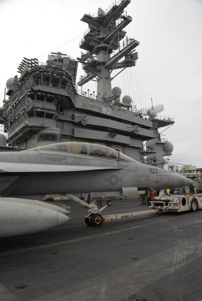 USS NIMITZ, At Sea - Sailors aboard the USS Nimitz ready an F/A-18 for takeoff during the joint exercise Valiant Shield 2007.  The USS Nimitz was one of three aircraft carriers which participated in the exercise. (Photo by Airman 1st Class Daniel Owen/ 36th Wing Public Affairs)