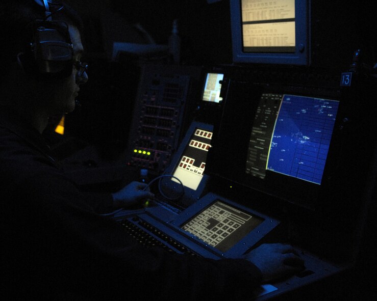 USS NIMITZ, At Sea - A Sailor aboard the USS Nimitz sits in darkness as he mans his post during the joint exercise Valiant Shield.  The USS Nimitz was one of three aircraft carriers which participated in the exercise. (Photo by Airman 1st Class Daniel Owen/ 36th Wing Public Affairs)