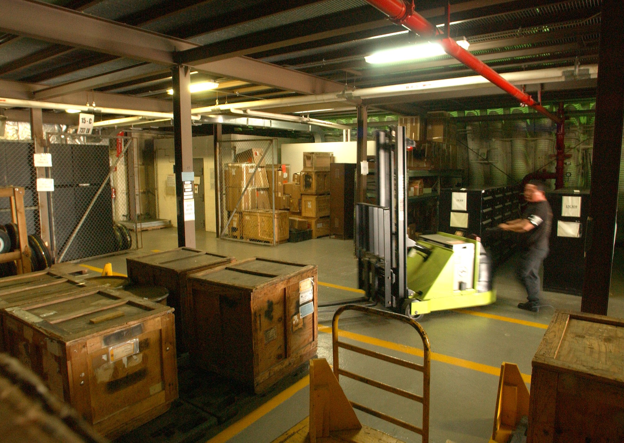 KUNSAN AIR BASE, South Korea — Mr. HaeKawon Sak, 8th Logistics Readiness Squadron, moves crates containing essential parts for F-16's at the Aircraft Parts Store here Aug.9. (U.S. Air Force photo/Senior Airman Steven R. Doty)     