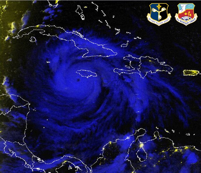 A Defense Meteorological Satellite Program nighttime image of Hurricane Dean churning in the Gulf of Mexico . The DMSP F-16 satellite image from 8:50 p.m. (EDT) Aug. 19, is a multispectral image that uses both infrared and visual satellite imagery to produce a color composite that reveals clouds and lights. The infrared portion is in blue, showing clouds, and the visible portion is in yellow, showing city lights. Image courtesy of the Air Force Weather Agency. 