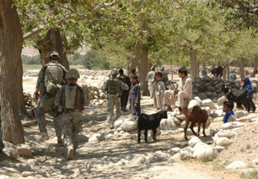 U.S. Army soldiers conduct a dismounted patrol with Afghan National Police officers in the Kapisa Province of Afghanistan, Aug. 16, 2007. 