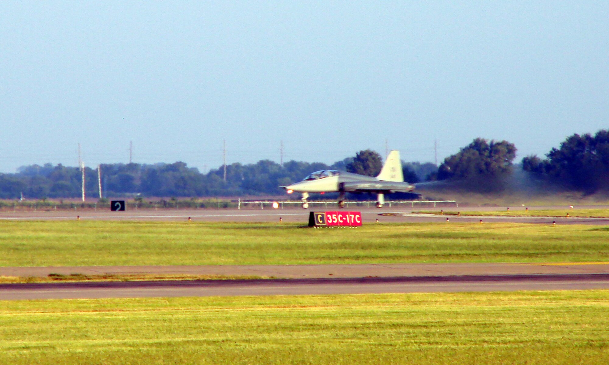 2nd Lt. Clay Bird, Introduction to Fighter Fundamentals student, and Capt. Nathan Thompson, 3rd Fighter Training Squadron flight commander, take off in an AT-38 Wednesday for the first sortie of the inaugural IFF class at Vance.  The class started Aug. 13 and will conclude in eight weeks. Upon return from the sortie, Lieutenant Bird said "there is work to be done," but he was happy to have completed the flight. (Air Force photo by Capt. Tony Wickman)