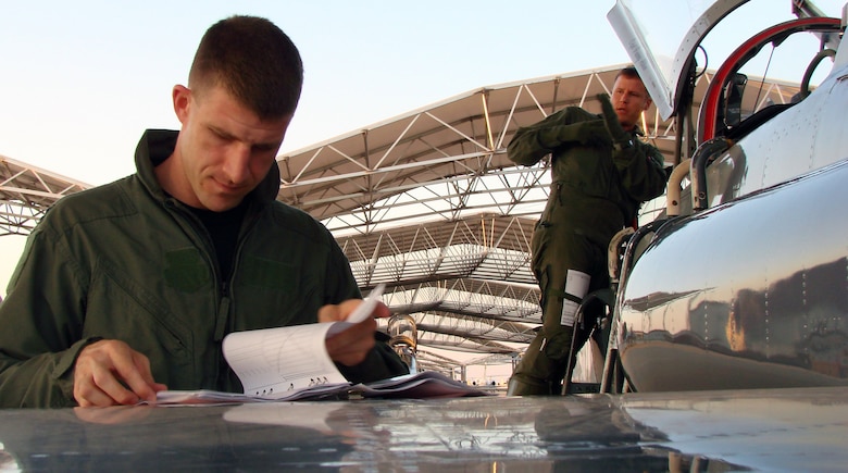 Capt. Nathan Thompson, 3rd Fighter Training Squadron flight commander, and 2nd Lt. Clay Bird, Introduction to Fighter Fundamentals student, prepare their AT-38 Wednesday for the first sortie of the inaugural IFF class at Vance.  The class started Aug. 13 and will conclude in eight weeks. (Air Force photo by Capt. Tony Wickman)