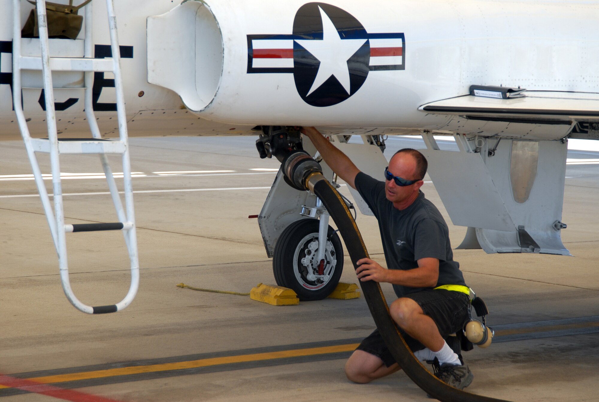 Kevin West, 912th Aircraft Maintenance Squadron T-38 Talon crew chief, helps refuel the T-38. The 95th Mission Support Group Fuels Supply Division provides Edwards with millions of gallons of fuel every month. (Photo by Airman 1st Class Mike Young)