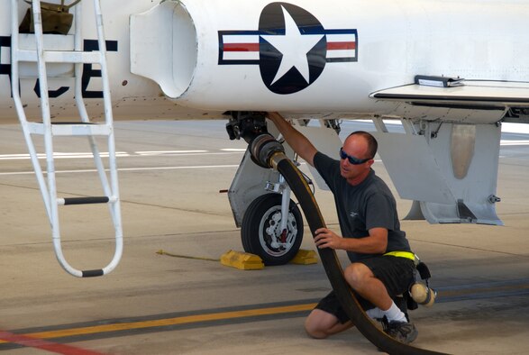 Kevin West, 912th Aircraft Maintenance Squadron T-38 Talon crew chief, helps refuel the T-38. The 95th Mission Support Group Fuels Supply Division provides Edwards with millions of gallons of fuel every month. (Photo by Airman 1st Class Mike Young)