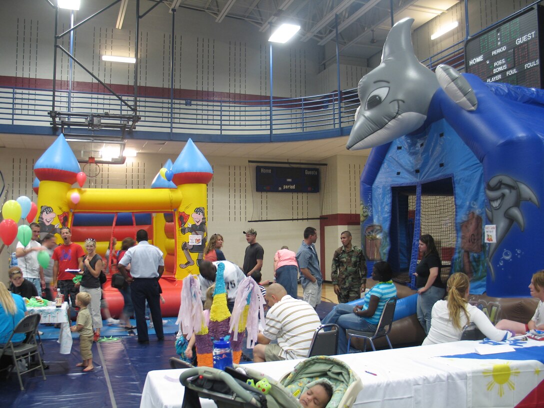 The Ellsworth community gathered together to take a brief break from the grind of day-to-day life during the base picnic Aug. 20. Centrally located at the Bellamy Fitness Center, this annual family-friendly event was sponsored primarily by local businesses as a way to say thank you to active-duty Airmen, retirees, Department of Defense civilians and families for their hard work, dedication and sacrifices. The picnic featured free food, athletic competitions, tournaments and children-specific activities from arts and crafts to jumping castles. (U.S. Air Force photo/Staff Sgt. Shanda De Anda)