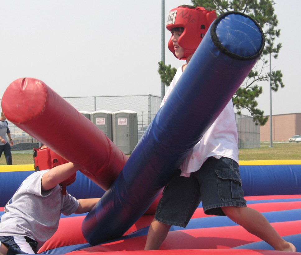 Sons of Ellsworth Airmen challenge each other to a match of skill as they compete for bragging rights during the Ellsworth base picnic Aug. 20. This annual family-friendly event was sponsored primarily by local businesses as a way to say thank you to active-duty Airmen, retirees, Department of Defense civilians and families for their hard work, dedication and sacrifices. The picnic featured free food, athletic competitions, tournaments and children-specific activities from arts and crafts to jumping castles. (U.S. Air Force photo/Staff Sgt. Shanda De Anda)