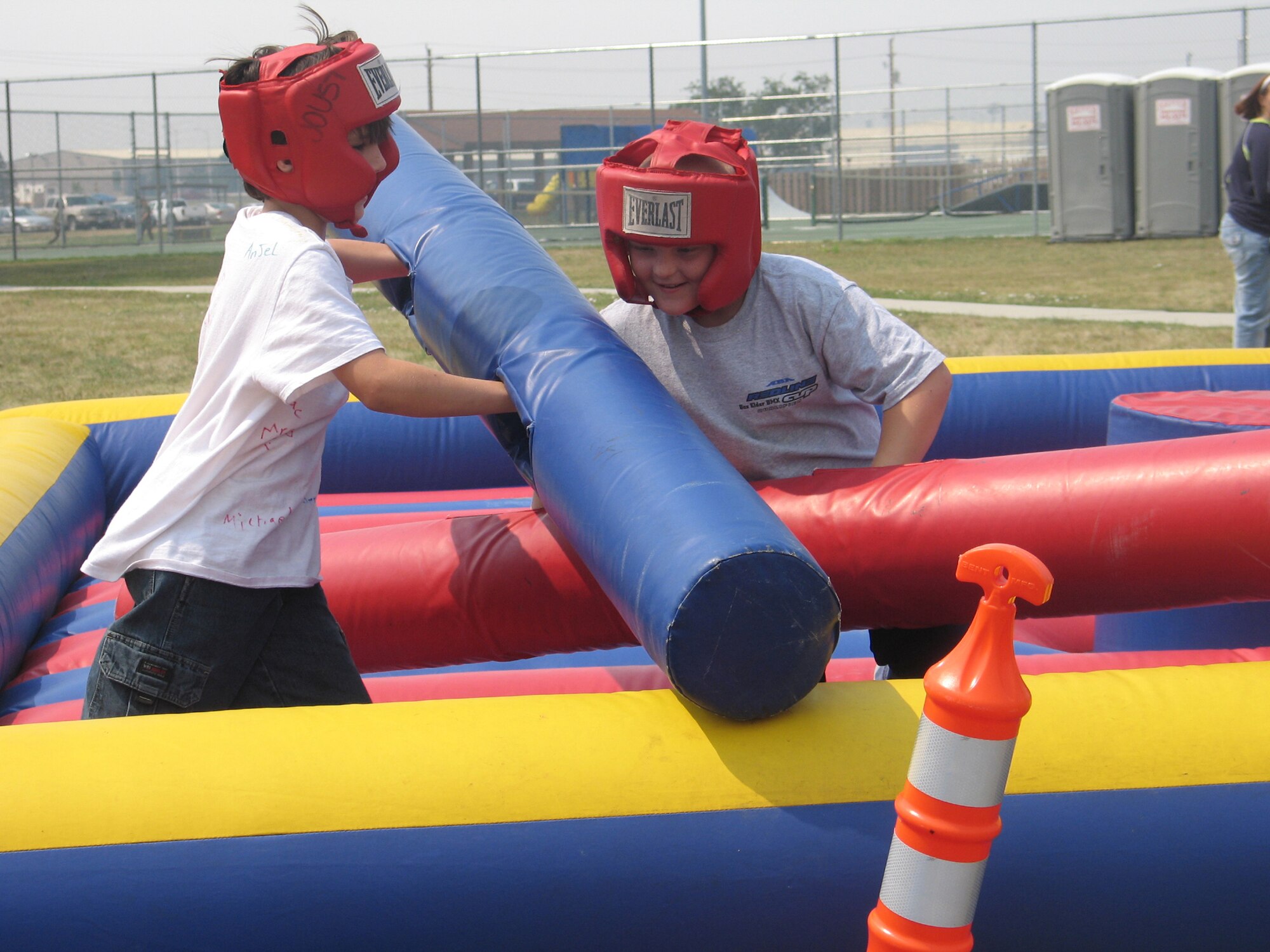 Sons of Ellsworth Airmen challenge each other to a match of skill as they compete for bragging rights during the Ellsworth base picnic Aug. 20. This annual family-friendly event was sponsored primarily by local businesses as a way to say thank you to active-duty Airmen, retirees, Department of Defense civilians and families for their hard work, dedication and sacrifices. The picnic featured free food, athletic competitions, tournaments and children-specific activities from arts and crafts to jumping castles. (U.S. Air Force photo/Staff Sgt. Shanda De Anda)