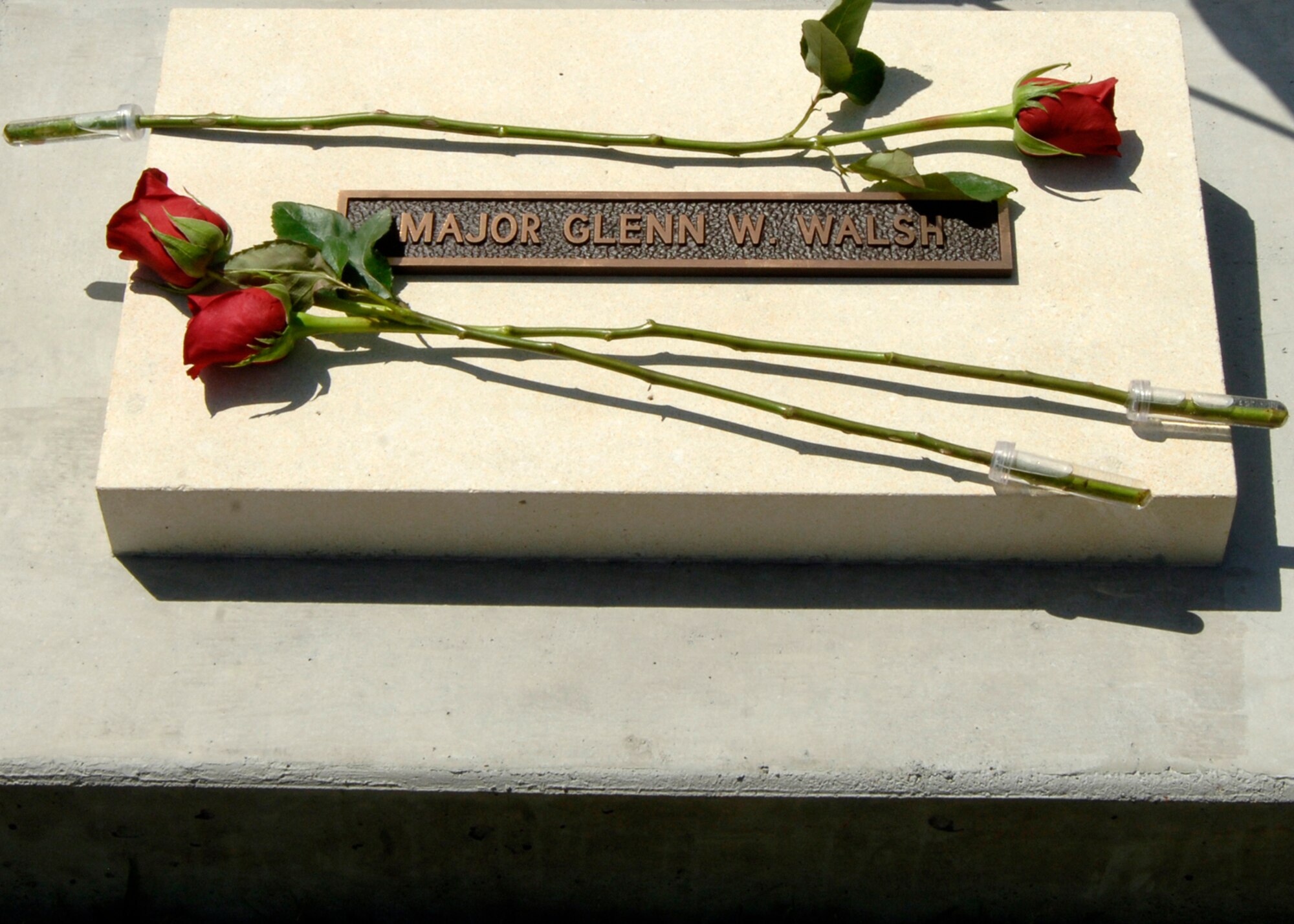 MCCONNELL AIR FORCE BASE, Kan. – A memorial stone is dedicated to the late Maj. Glenn Walsh Aug.10 at the memorial walk. Memorial stones are dedicated to deceased McConnell members for their dedication to the base and the Air Force.(photo by Airman 1st Class Laura Suttles)