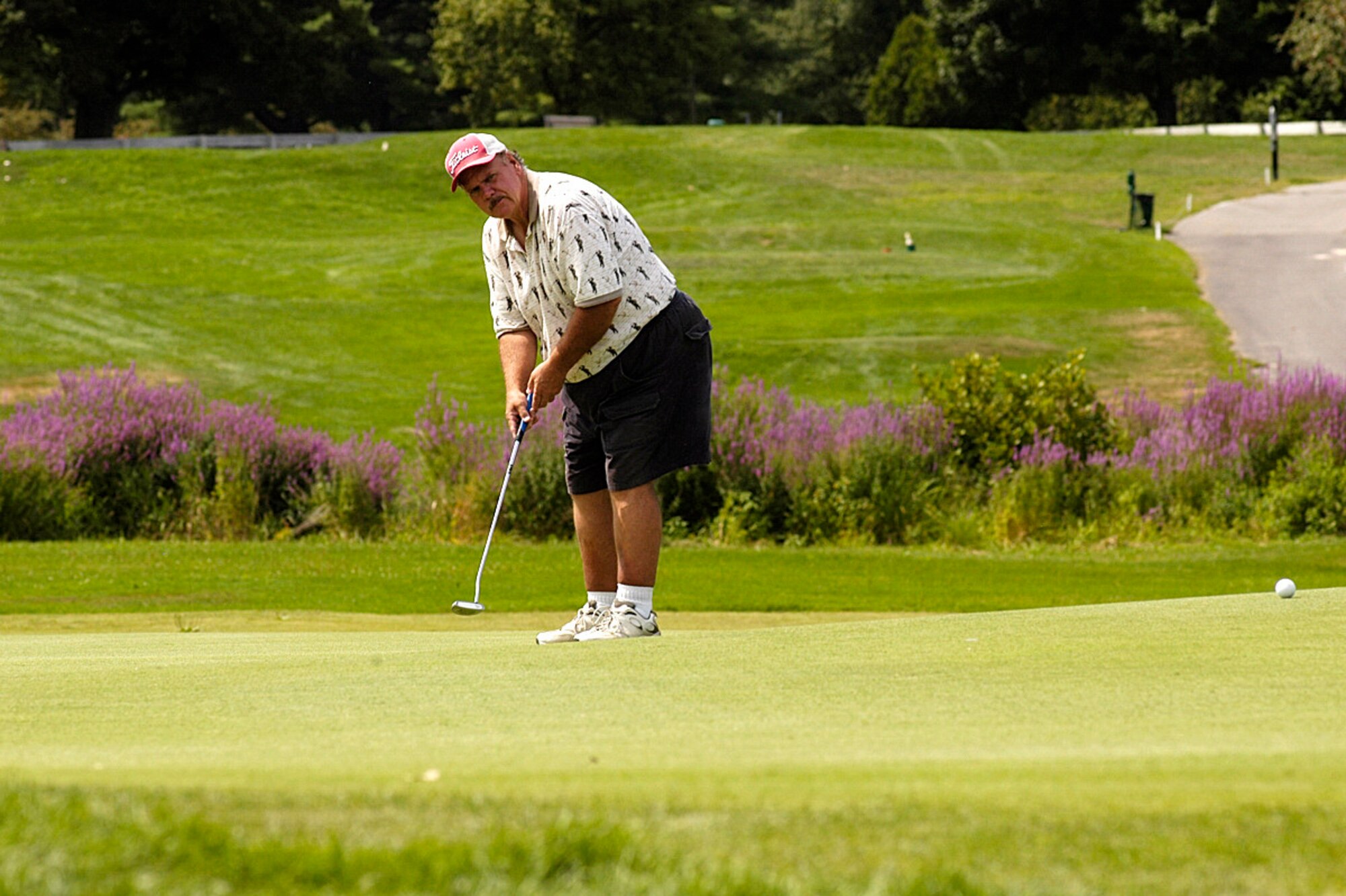 Hanscom Air Force Base, Mass. -- Paul Peters putts the ball during the recent Patriot Golf Course Championship Tournament. (U.S. Air Force photo by Walter Santos)