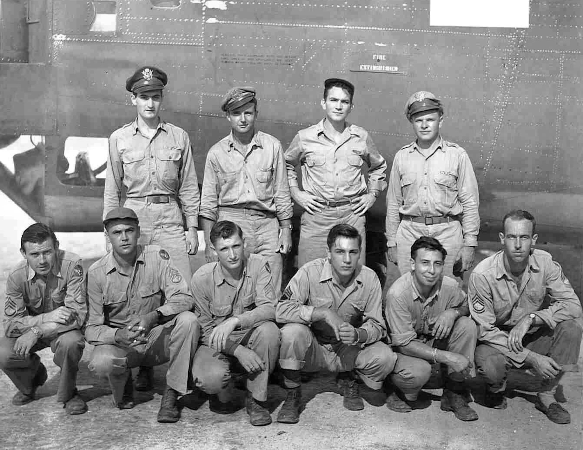 Staff Sgt Roy E. Talbott is shown third from left in the bottom row with fellow crewmembers during World War II. Mr. Talbott received a Purple Heart Aug. 21 at Randolph Air Force Base, Texas. He served as a B-24 gunner with the 72nd Bomb Squadron of the 13th Air Force's 5th Bomb Group, and received the Purple Heart for injuries he received in an attack by Japanese fighter planes in the Pacific Theater during World War II. (Courtesy photo)