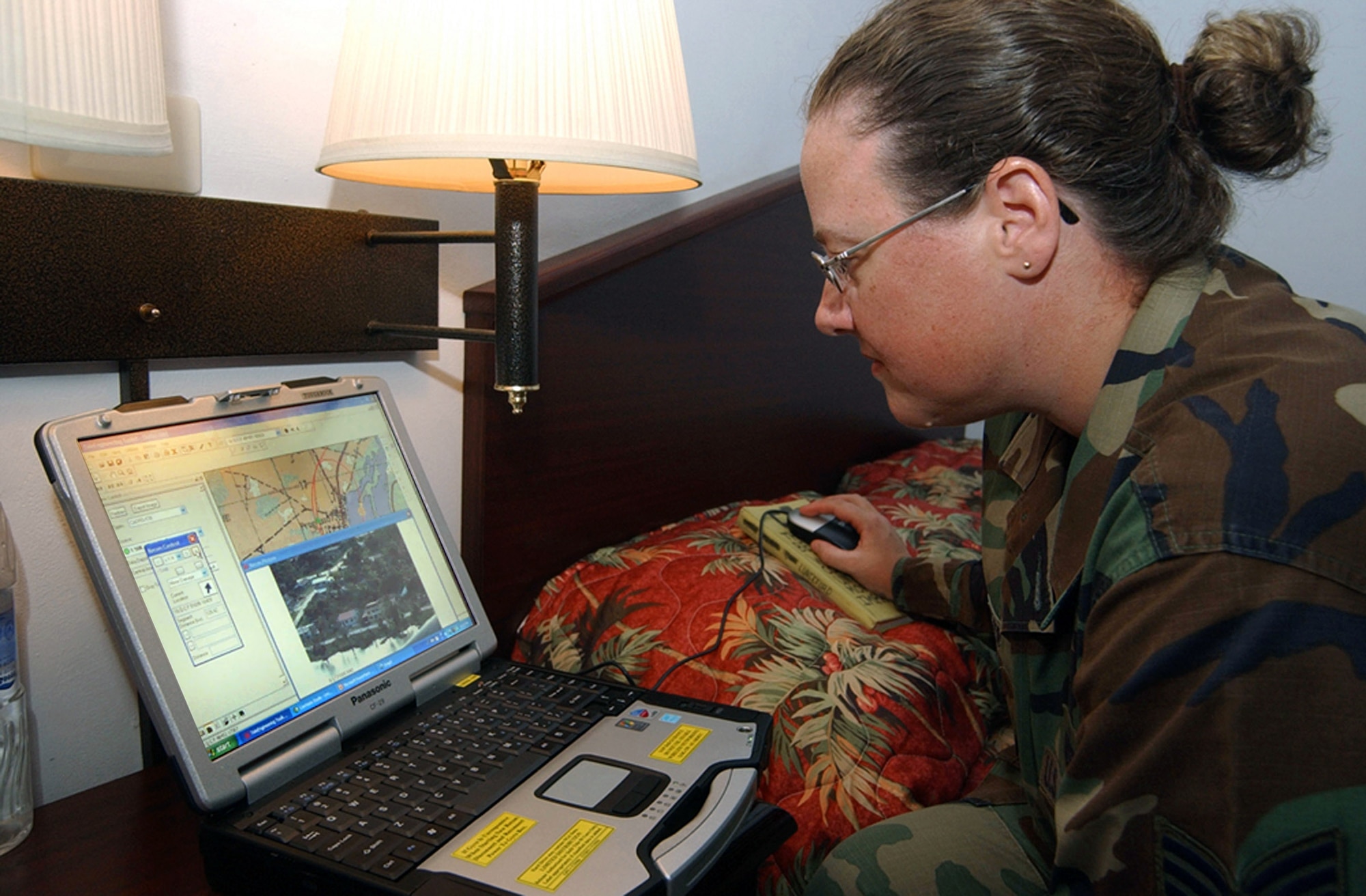 Tech. Sgt. Heather Prater reviews the video captured after flying on a survey mission to assess damage in Belize City, Belize, caused by Hurricane Dean Aug. 21. Sergeant Prater is here with approximately 20 U.S. Soldiers and Airmen serving on an initial assessment team following the landfall of the hurricane. She is a civil engineer deployed from Fairchild Air Force Base, Wash. (U.S. Air Force photo/Tech. Sgt. Sonny Cohrs) 