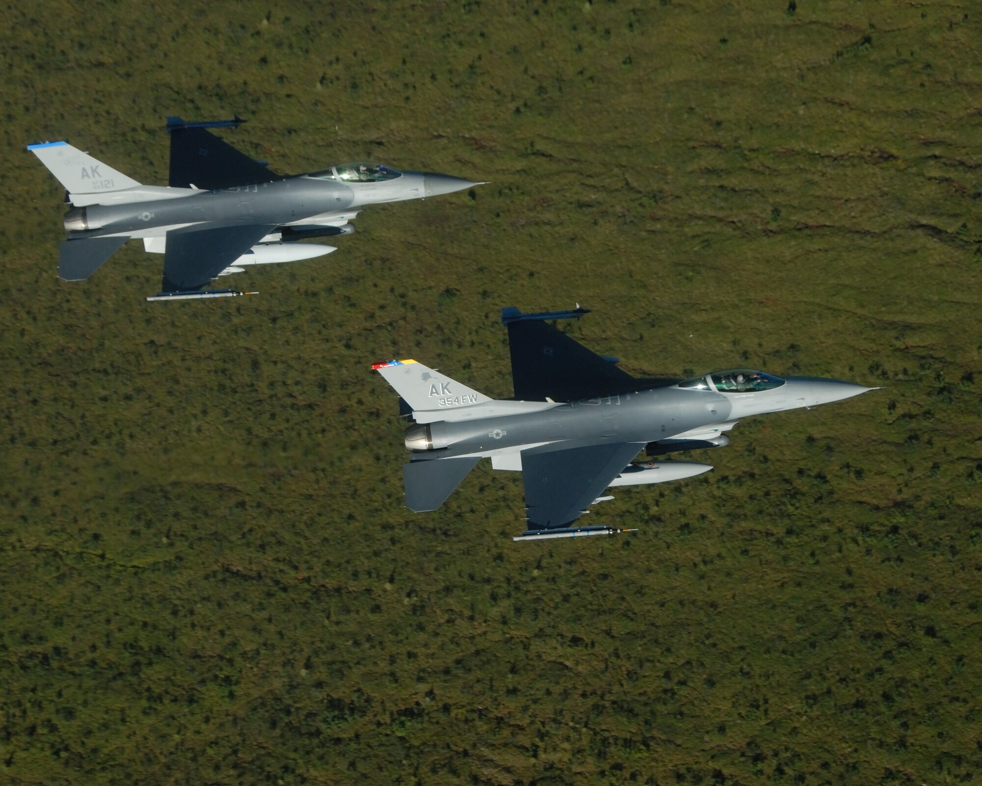 EIELSON AIR FORCE BASE, Alaska -- Brig. Gen. David Scott, 354th Fighter Wing Commander, flies in formation in a F-16 Fighting Falcon aircraft during his fini flight on Aug. 17. General Scott arrived at Eielson AFB back in Dec. 05 and will be departing in Aug. 07 to a North Atlantic Treaty Organization base in Greece as the Deputy Commander of Combined Air Operations Center. (U.S. Air Force Photo by Master Sgt Rob Wieland)