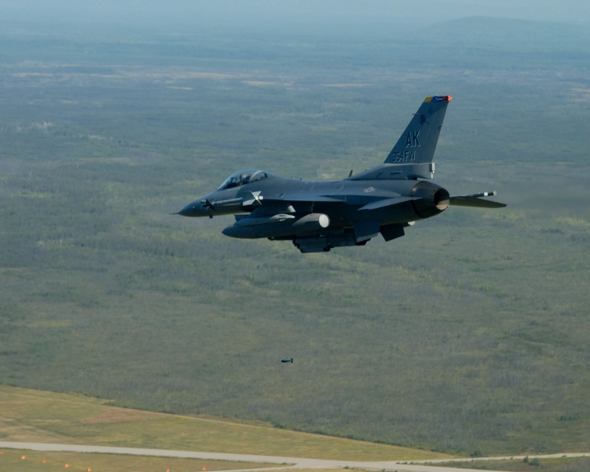 EIELSON AIR FORCE BASE, Alaska -- Brig. Gen. David Scott, 354th Fighter Wing Commander, drops a BDU-33 in a F-16 Fighting Falcon aircraft during his fini flight on Aug. 17. General Scott arrived at Eielson AFB back in Dec. 05 and will be departing in Aug. 07 to a North Atlantic Treaty Organization base in Greece as the Deputy Commander of Combined Air Operations Center. (U.S. Air Force Photo by Master Sgt Rob Wieland)