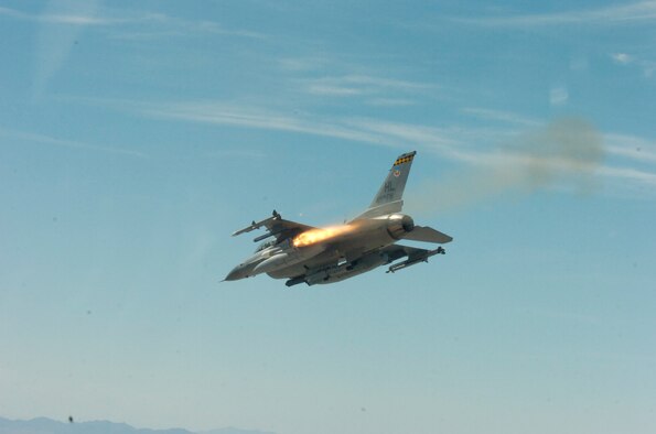 An F-16 from the 421st Fighter Squadron here releases a weapon over the Utah Test and Training Range during the Weapons System Evaluation Program Aug. 12-23, 2007. The program, better known as Combat Hammer, analyzes the bomb from the time it is built to the time it is deployed to determine how successful it might be in combat. (U.S. Air Force photo)