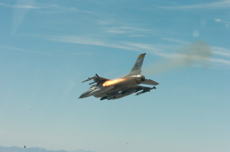 An F-16 from the 421st Fighter Squadron here releases a weapon over the Utah Test and Training Range during the Weapons System Evaluation Program Aug. 12-23.  The program, better known as ?Combat Hammer,? analyzes the bomb from the time it is built to the time it is deployed to determine how successful it might be in combat.